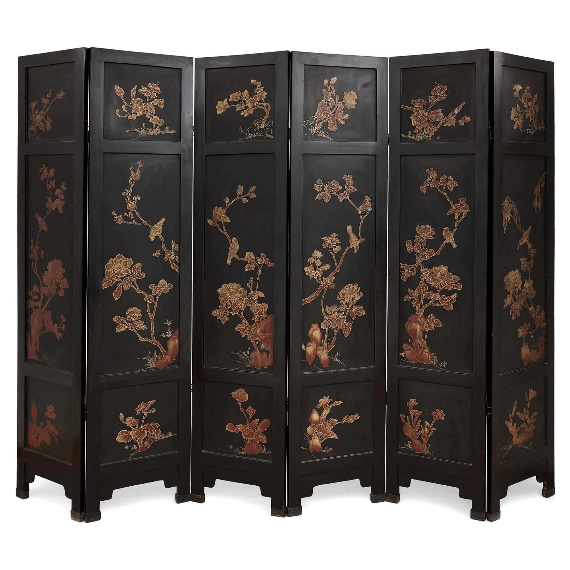 Large six-panelled Chinese hardstone and lacquered folding screen
Chinese, Early 20th Century
Closed: height 183cm, width 40.5cm, depth 18cm
Opened: height 183cm, width 243cm, depth 2.5cm

The large and intricately detailed screen is formed of six