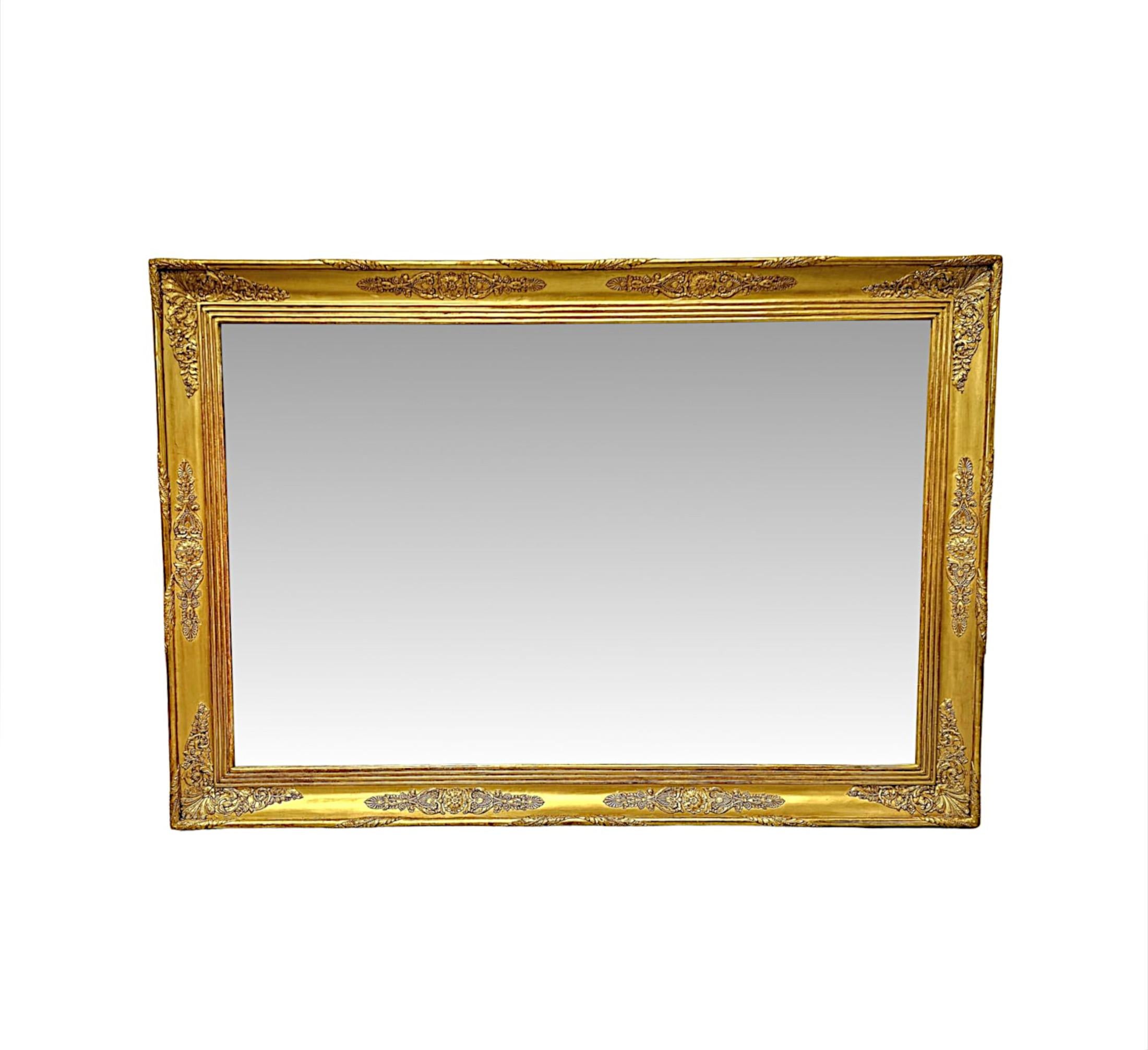 A fabulous 19th Century giltwood overmantel or hall mirror of large proportions, exceptional quality and can be hung in both the landscape or portrait formats.  The mirror glass plate of rectangular form is set within a finely hand carved, moulded,