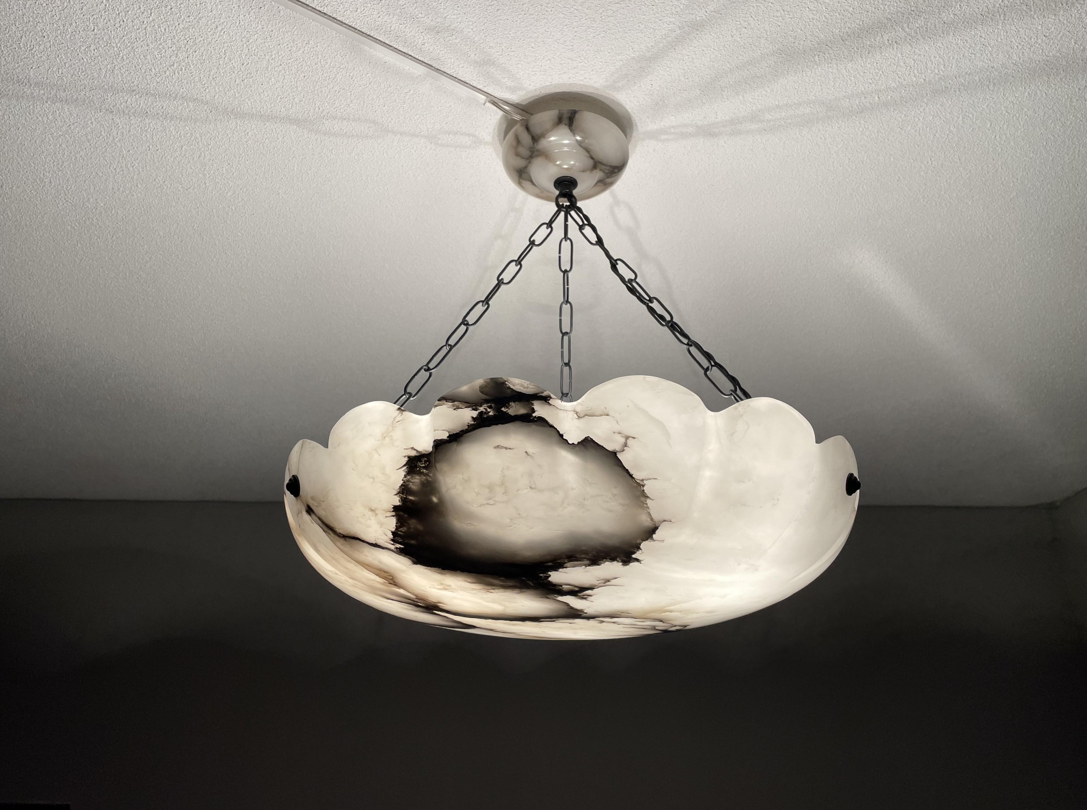 Timeless, three-light chandelier with a rare design and large size alabaster shade.

Thanks to its large size, good condition and timeless design this alabaster pendant or flush mount is the perfect lighting solution for many types of rooms and