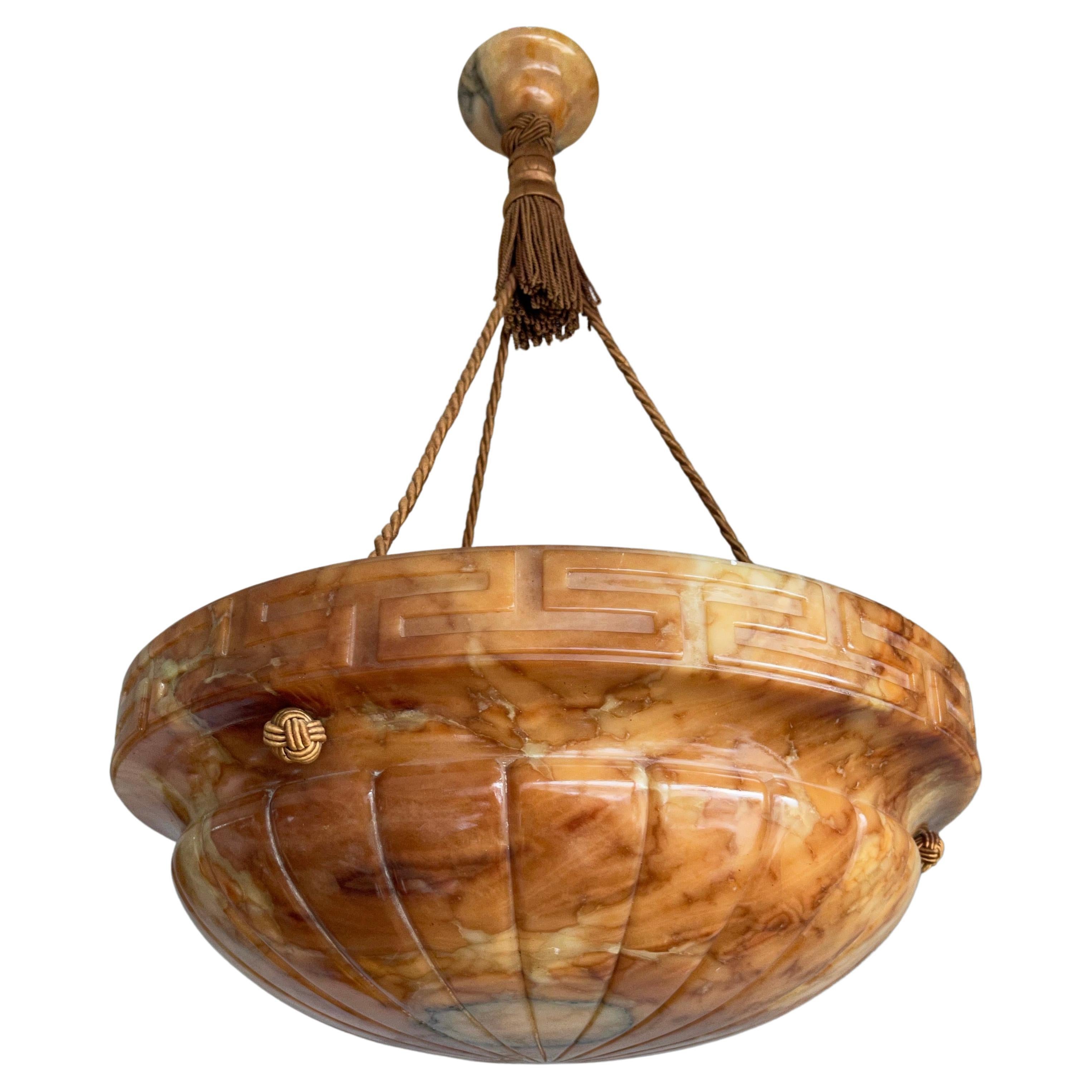 Beautiful design and wonderful light creating, mother nature mineral stone shade plaffonier ceiling light.

This marvelous and top quality carved, early 20th century alabaster pendant is hanging from the original alabaster canopy and perfectly