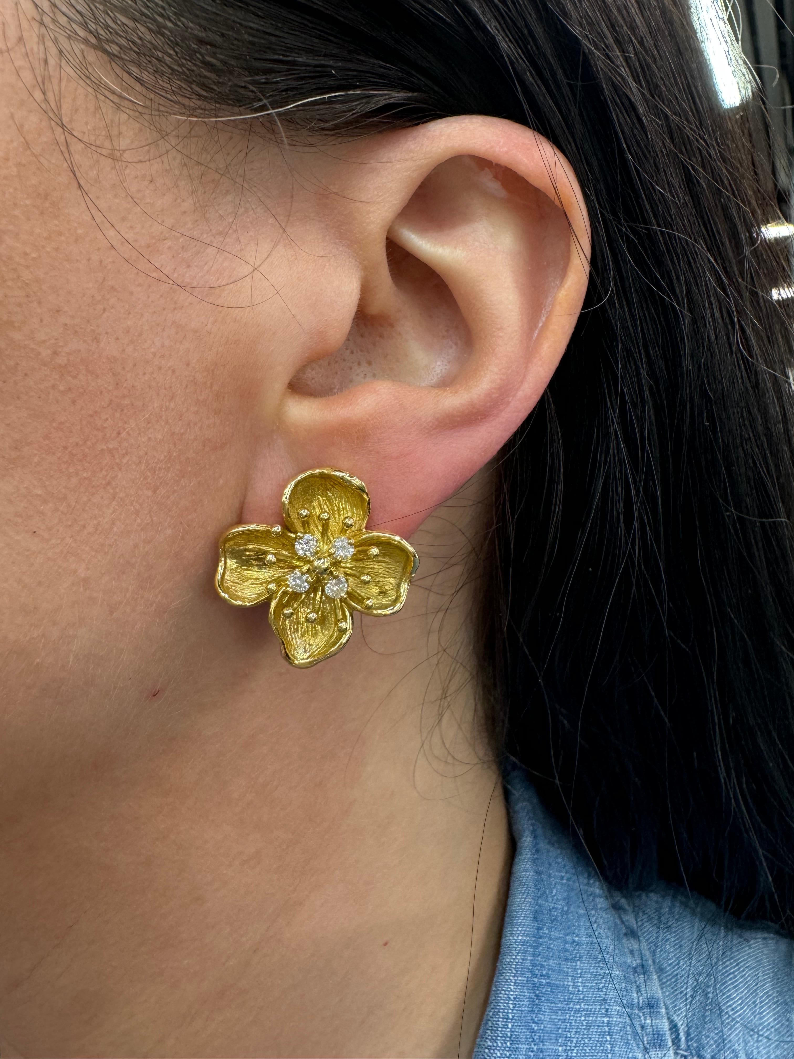 Large 18 karat yellow gold flower stud earrings featuring 8 round brilliants weighing 0.56 carats. 
Smaller version available
No diamond flower earrings available.
Search Harbor Diamonds