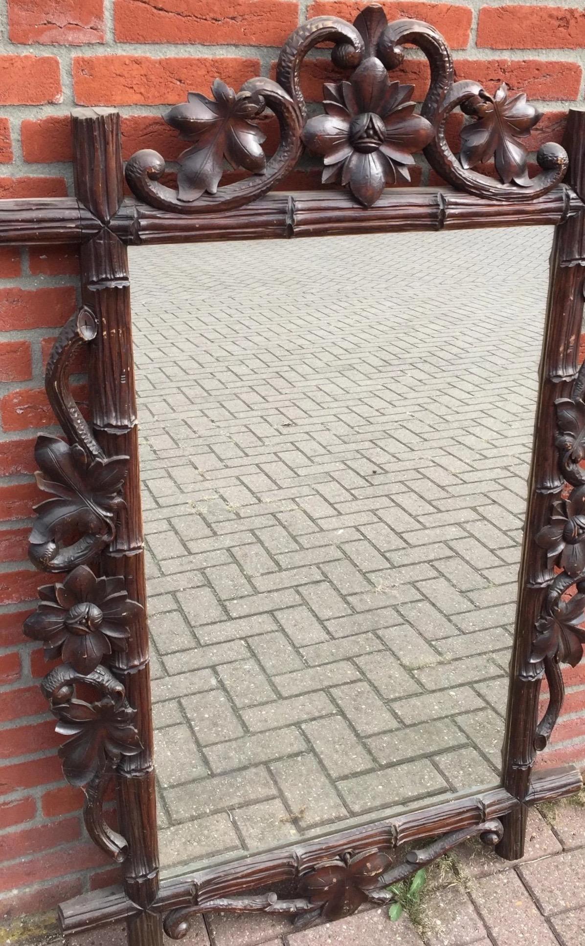 Antique, one of a kind and highly decorative, hand carved mirror. 

This beautiful, early 20th century, hand carved antique mirror is in great condition. The workmanship is of a quality and beauty that you just don't see anymore in this day and age
