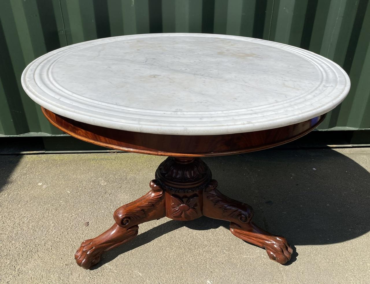 A lovely French Marble Top Gueridon Centre Table of large size than you normally see. Having its original white marble top with lovely grooves towards the outer edge. The mahogany base has lovely carved decoration and paw feet. Dating to the early