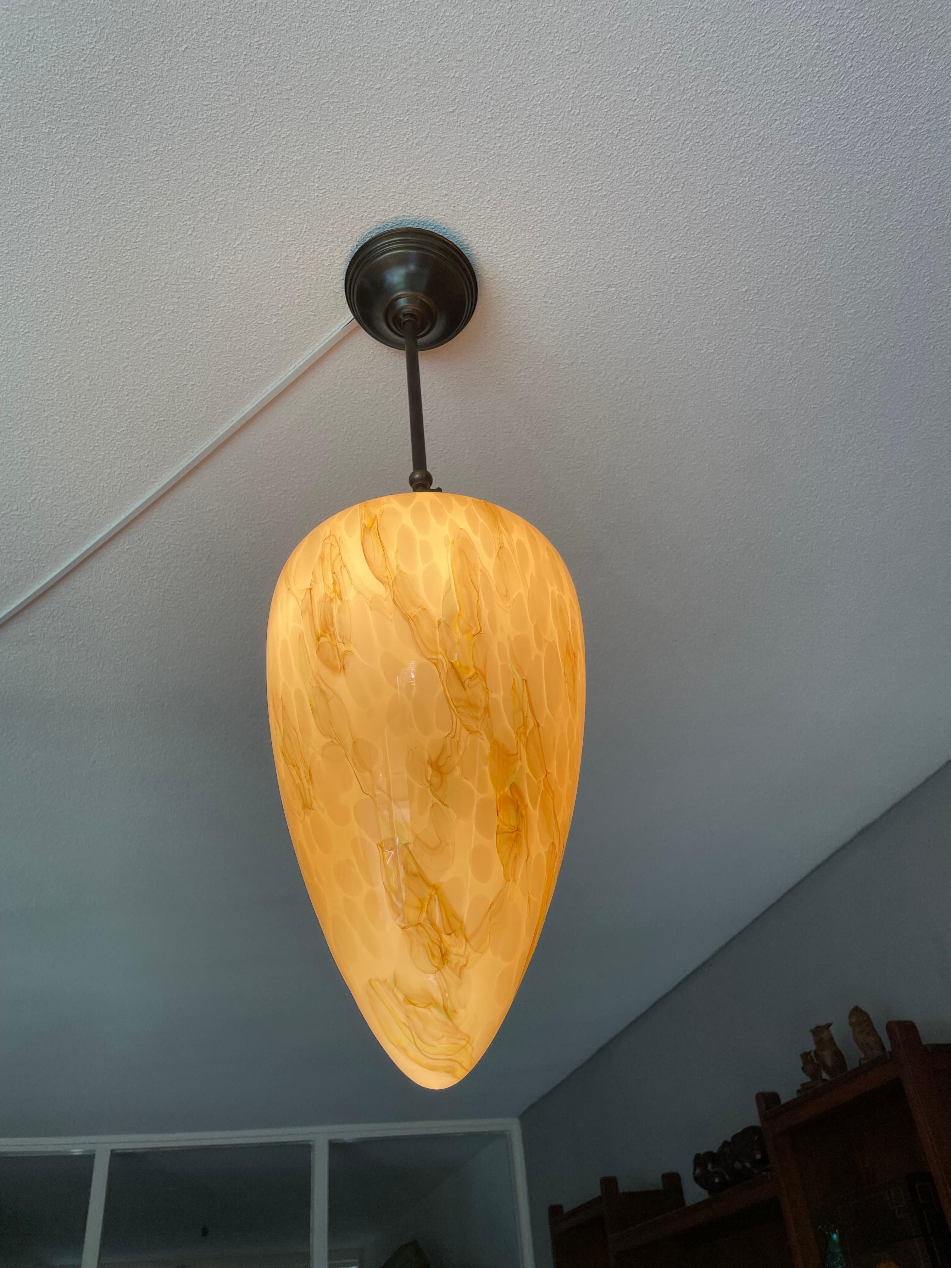 Incredibly beautiful, mouthblown glass, adjustable in height light fixture with a marble-look surface with amazing colors.

This rare, beautifully designed, upside-down cone shape pendant is destined to grace someone's entrance, stairwell, landing