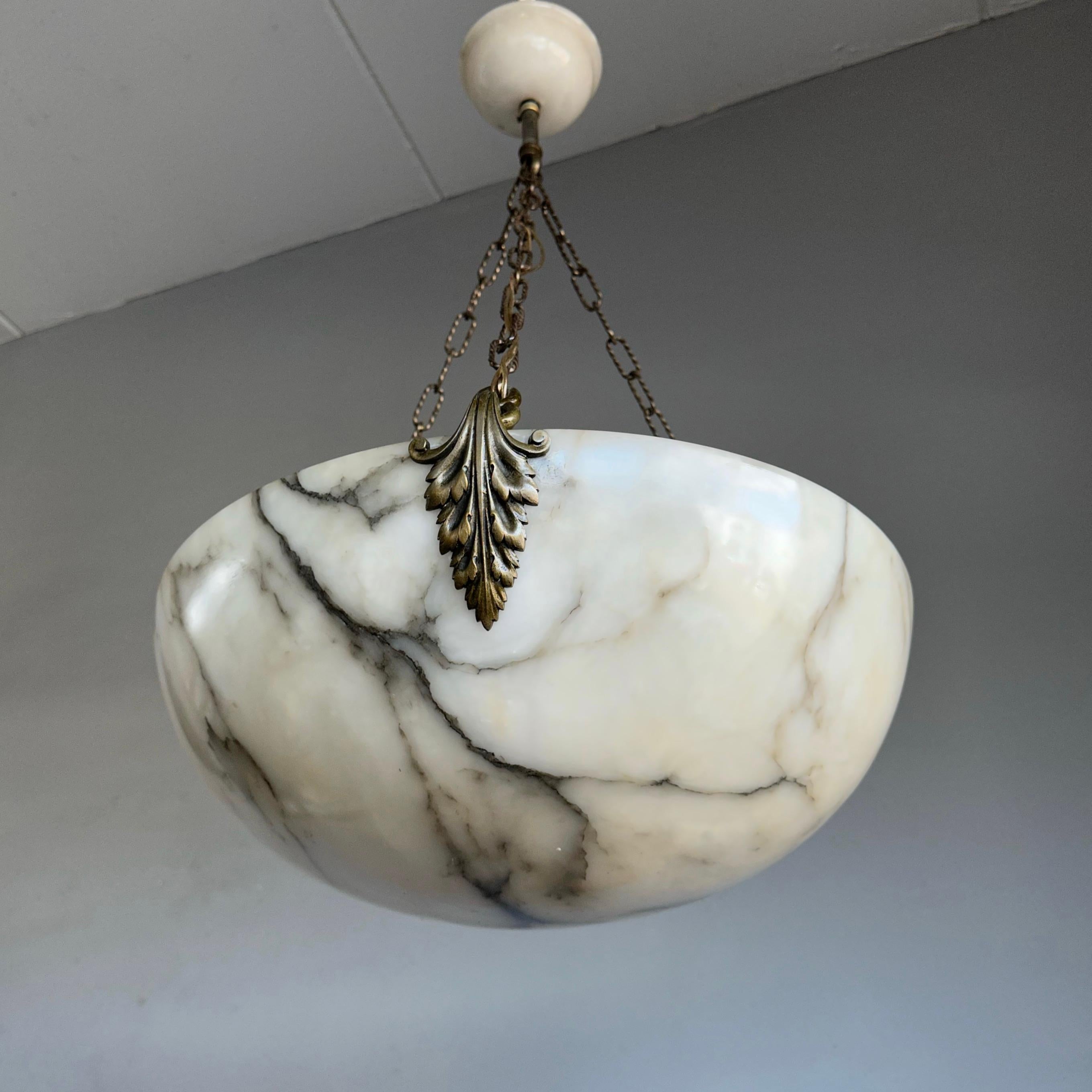 Top class antique chandelier with a large size alabaster mineral stone shade and canopy.

Thanks to its extra large size and great condition this alabaster chandelier will light up your days and evenings in a way that no modern fixture ever could.