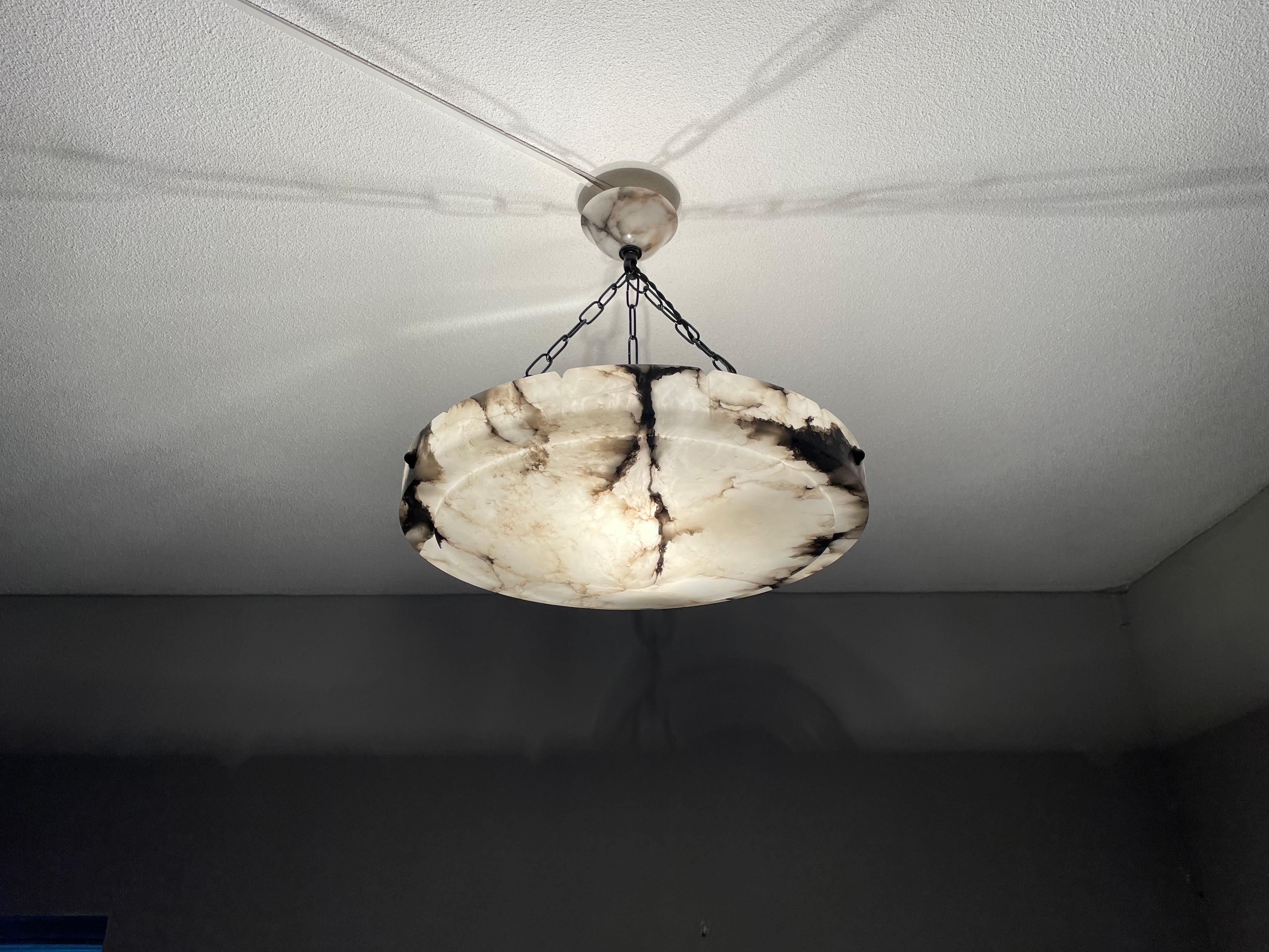 Stunning and large size, alabaster pendant of great quality AND design.

This rare design and fairly large chandelier from the heydays of the European Art Deco era will never fail to impress you (or anyone visiting) and it is certain to light up