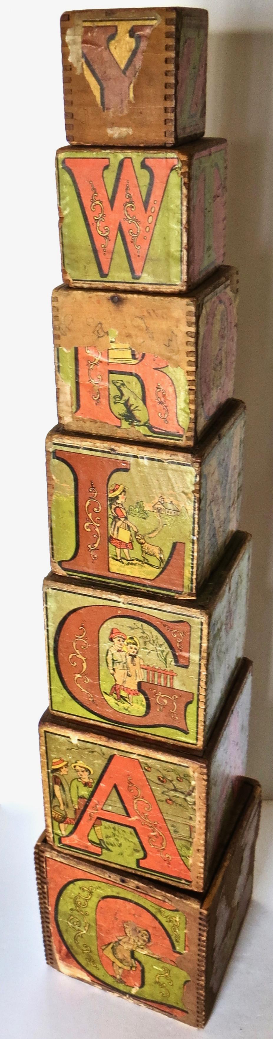 This is a large size set of colorful Victorian blocks which you just don't see anymore and are difficult to find. Considered an early learning device, these 19th century alphabet blocks were made of lithographed paper on wood, with scenes of