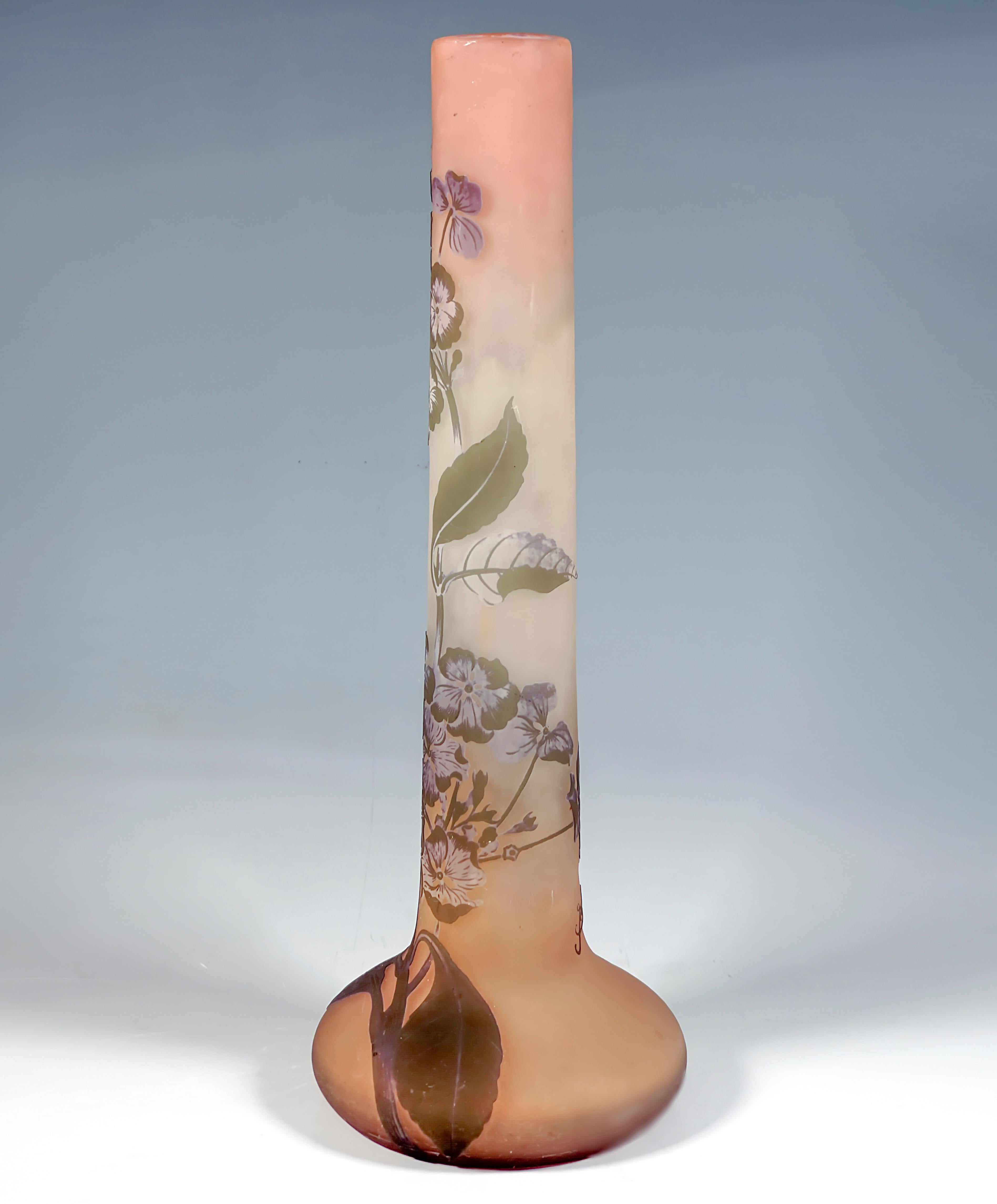 Tall rod vase with a slender, straight neck with a flat, bulbous body in the flush standing area, colorless glass with yellow and reddish colored powder inclusions, overlay in moss green and violet, in various stages highly etched hydrangea