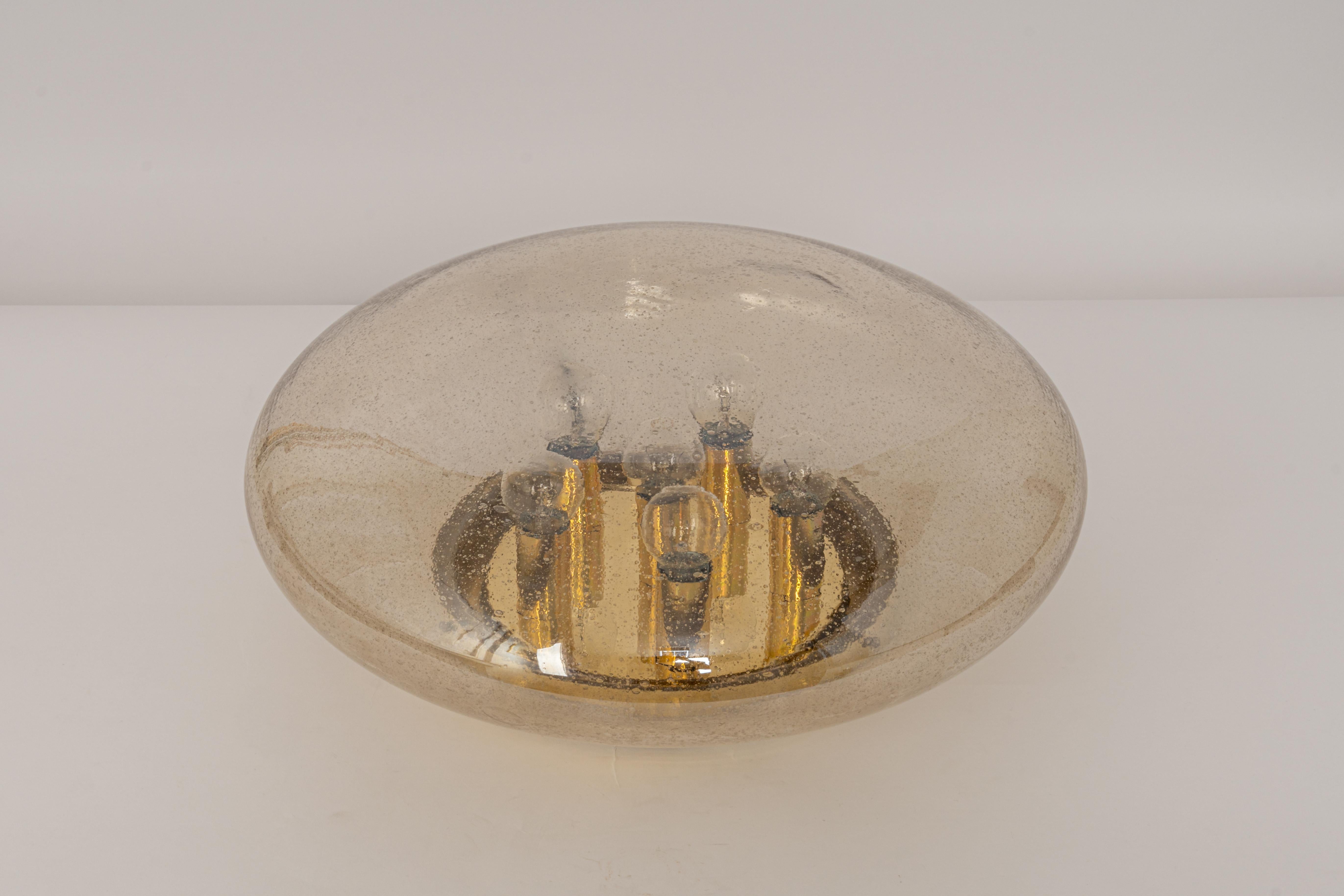 Large smoked Glass flush mount manufactured by Limburg Glashütte Germany, circa 1960-1969. Wonderful spaceship form and a stunning light effect with the raindrops.

High quality and in very good condition. Cleaned, well-wired, and ready to use.