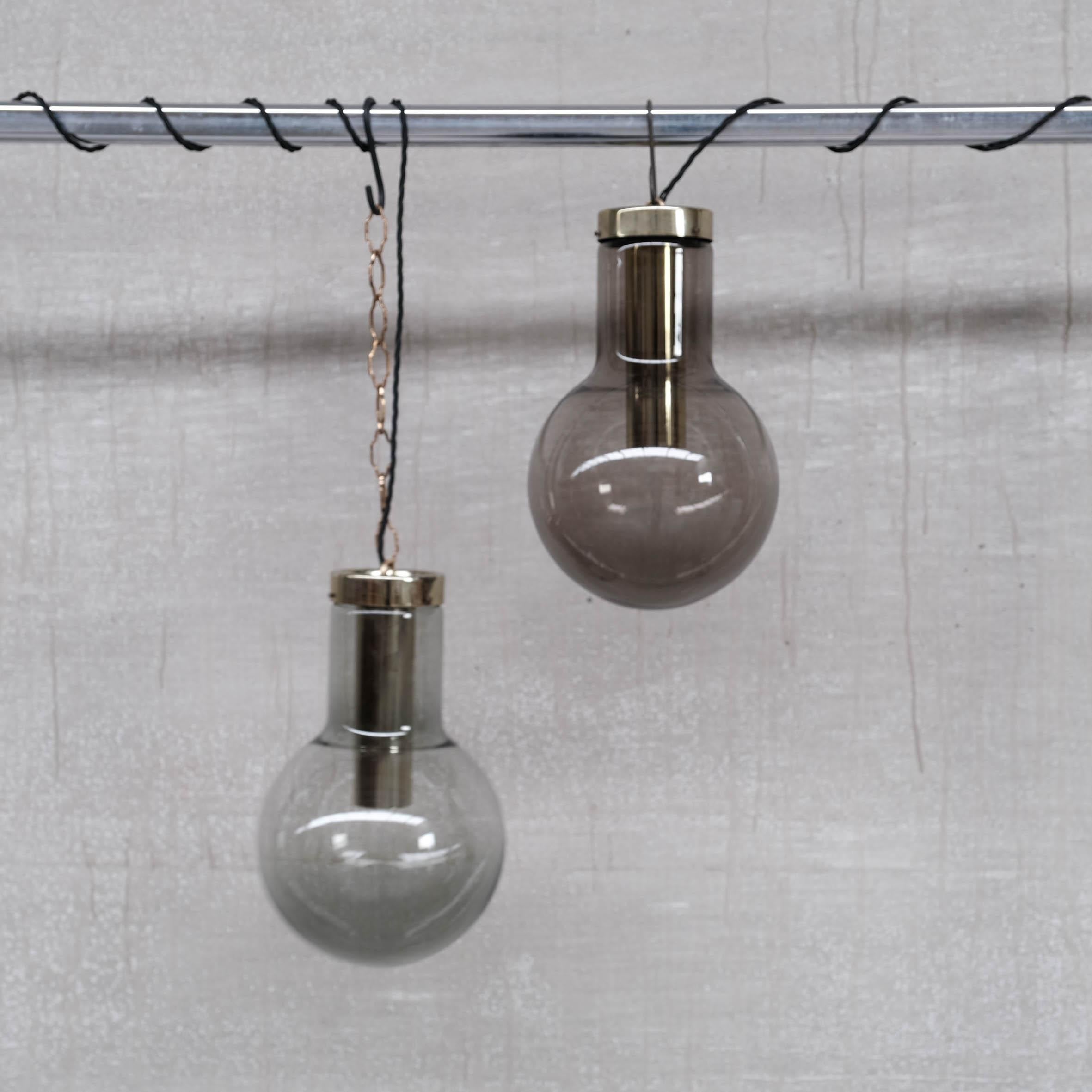 Large Smoked Midcentury Glass and Brass Pendant Lights by RAAK '2 Available' For Sale 1