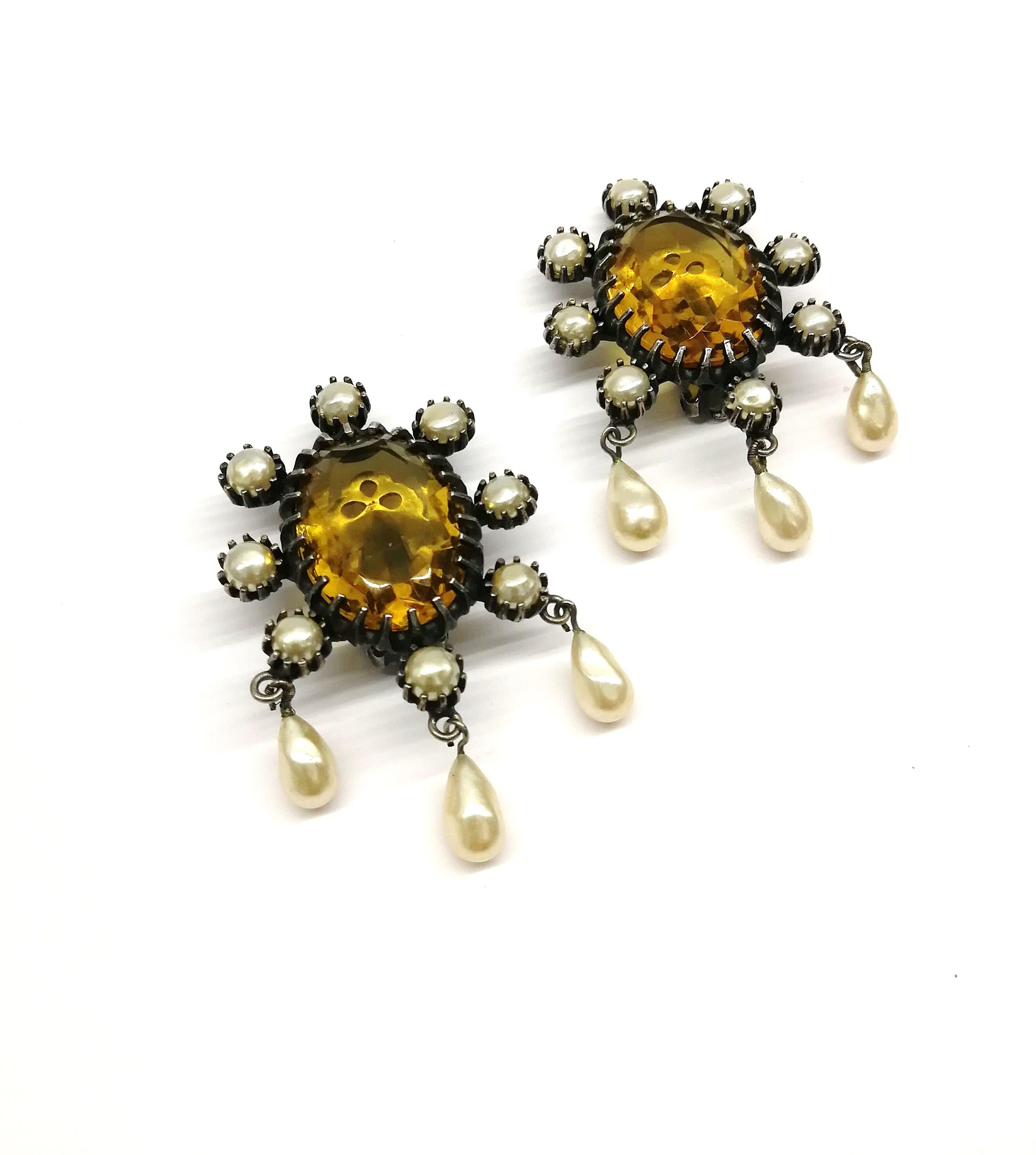 
These earrings are of a great colour combination, the smokey quartz contrasting with soft cream drop pearls, making them subtle, yet eye catching . They are of the highest quality, as is all Mitchel Maer/Christian Dior jewellery, sitting flat and