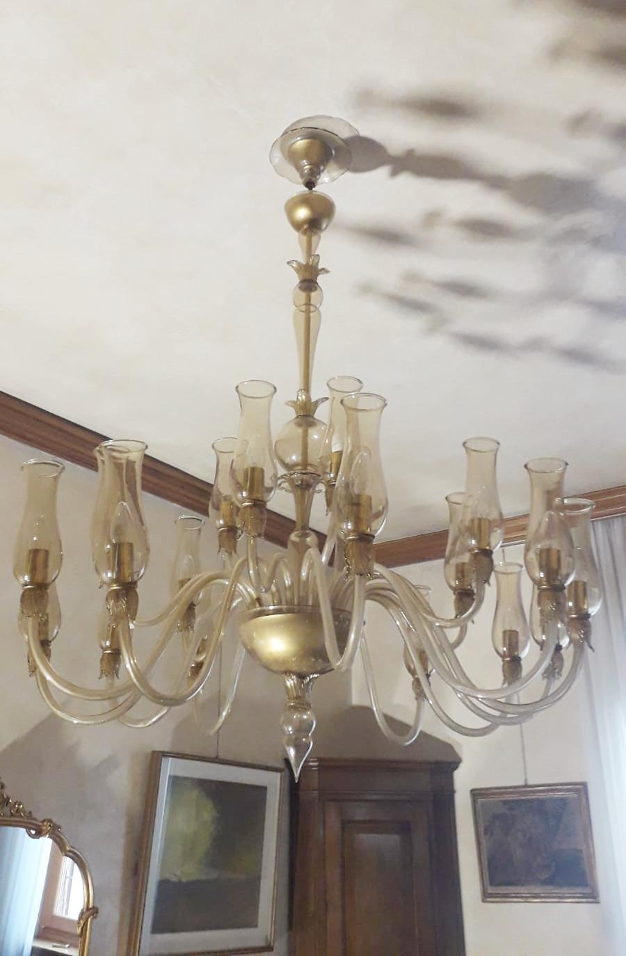 Vintage Venetian chandelier with smoky Murano glass / made in Italy circa 1950s by Galliano Ferro
20-light / E12 or E14 type / max 40W each
Measures: Height 61 inches, diameter 47 inches
Order Reference #: FABIOLTD C558
  