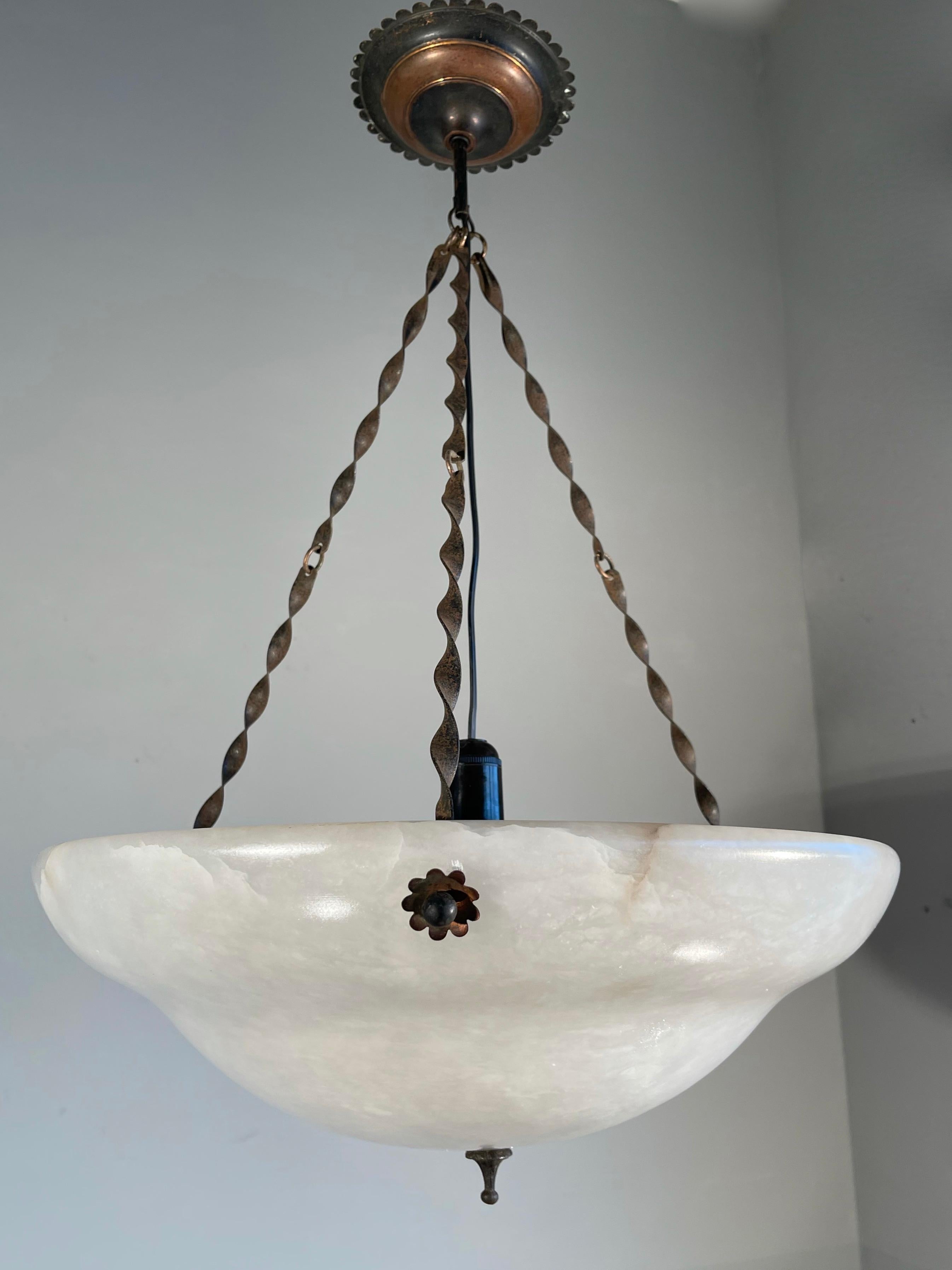 Vintage and top condition large white mineral stone ceiling fixture.

For the private buyers and interior designers we also have this large and pure white alabaster pendant. Its impressive size and unique chain of twisted brass with a remarkable