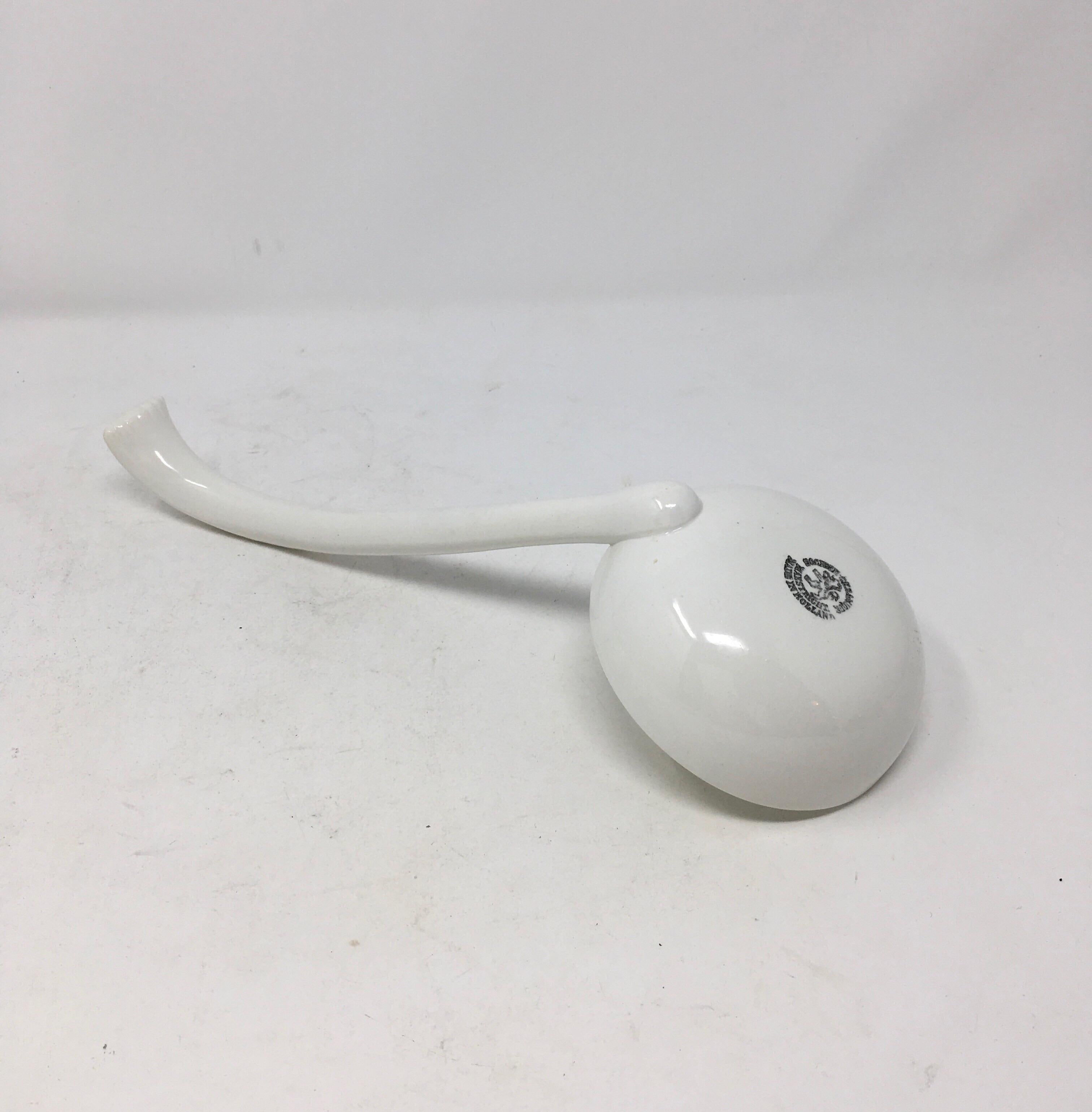 A rare find, this large Dutch antique white ironstone ladle is marked on the bottom of the bowl with a black underglaze stamp: Societe Ceramique Maestricht, made in Holland. Societe Ceramique produced ironstone in Maestricht from 1863-1955. The