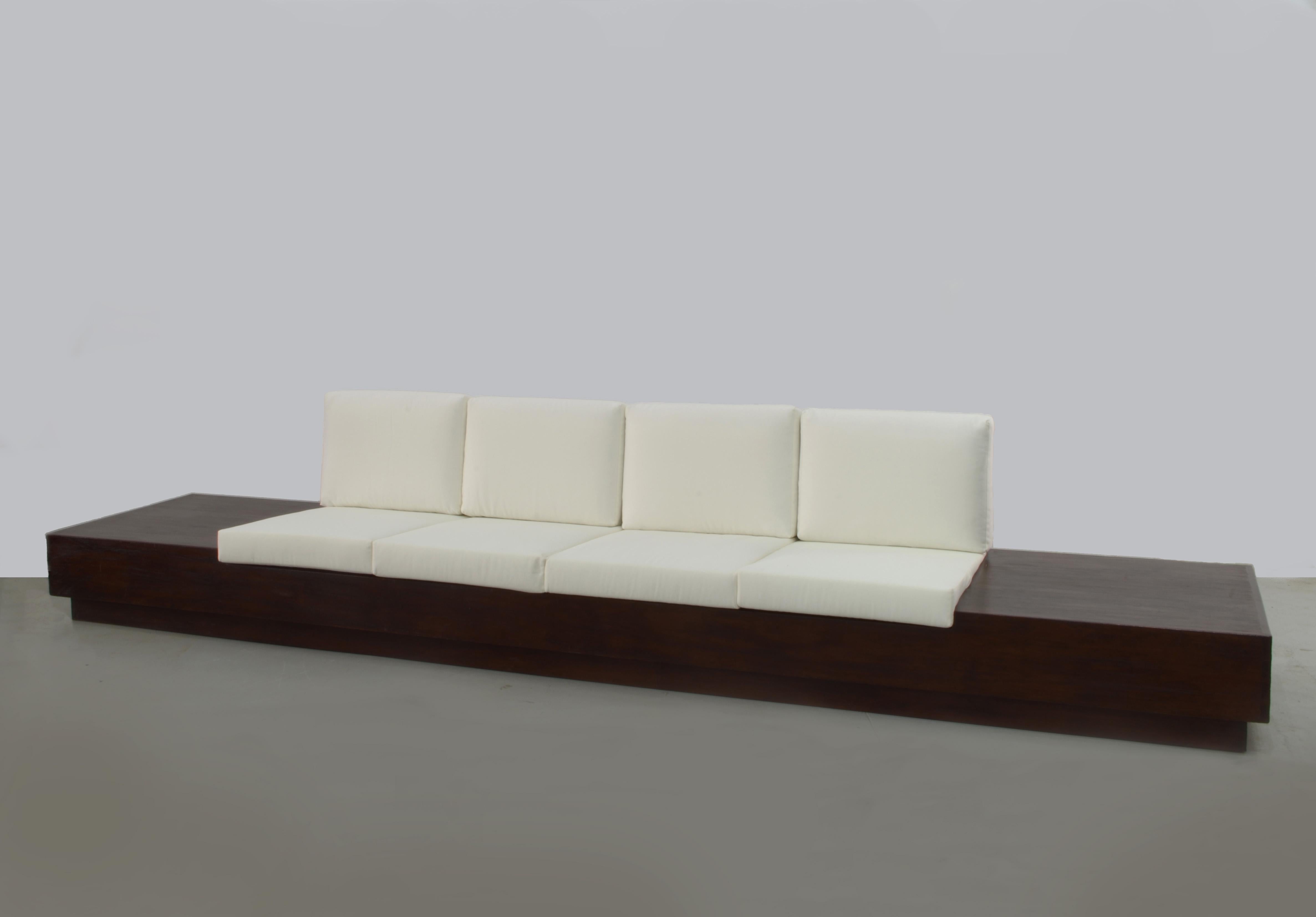 Extremely rare sofa by Joaquim Tenreiro. With 4 meters width, this elegant bench, made in solid cedar comfortably accommodates 4 people and has a side space that may be used as a side table. The piece has been completely restored. 

Tenreiro is
