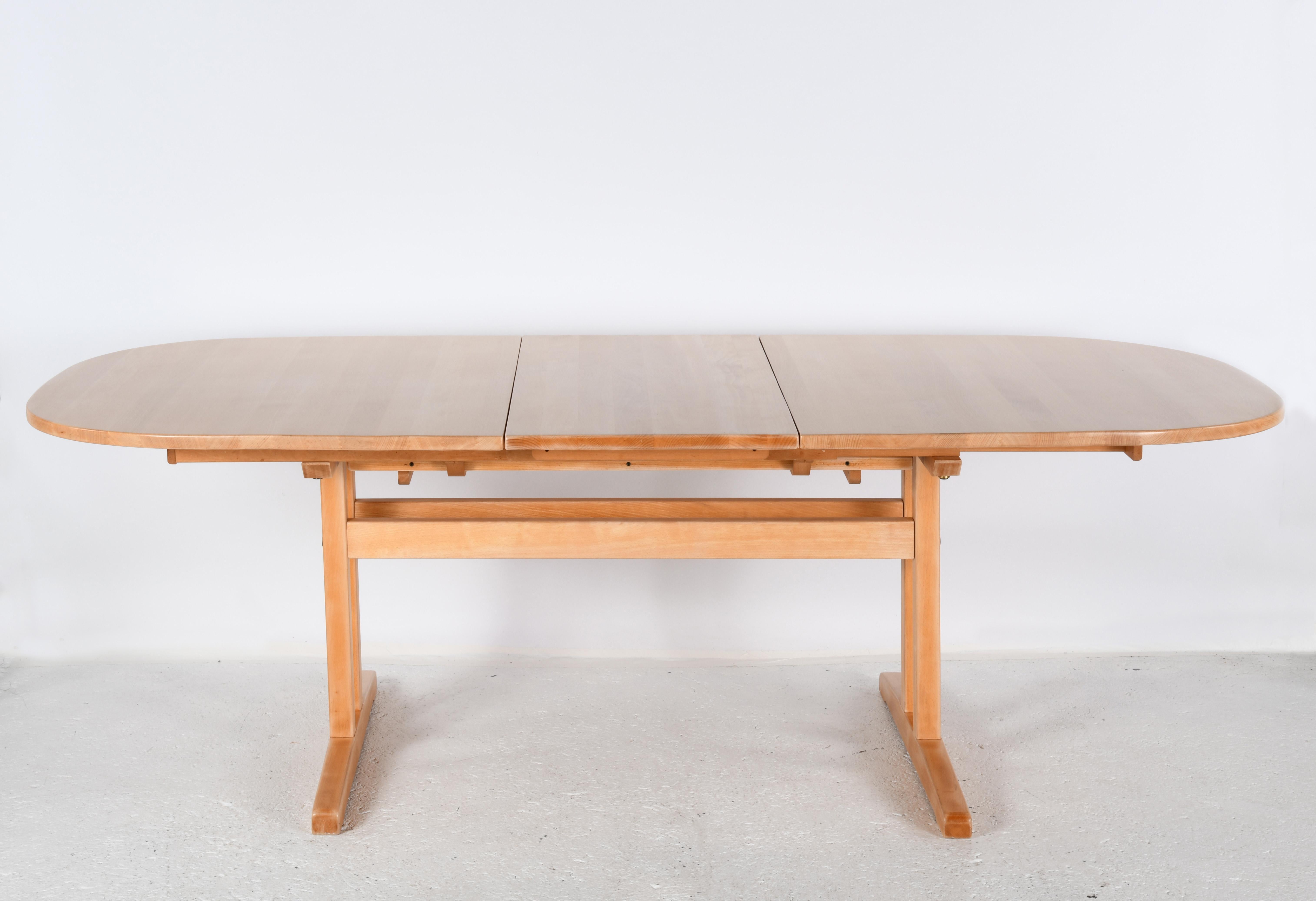 Large solid beech oval table with sliding top and two extensions. For Sale 2