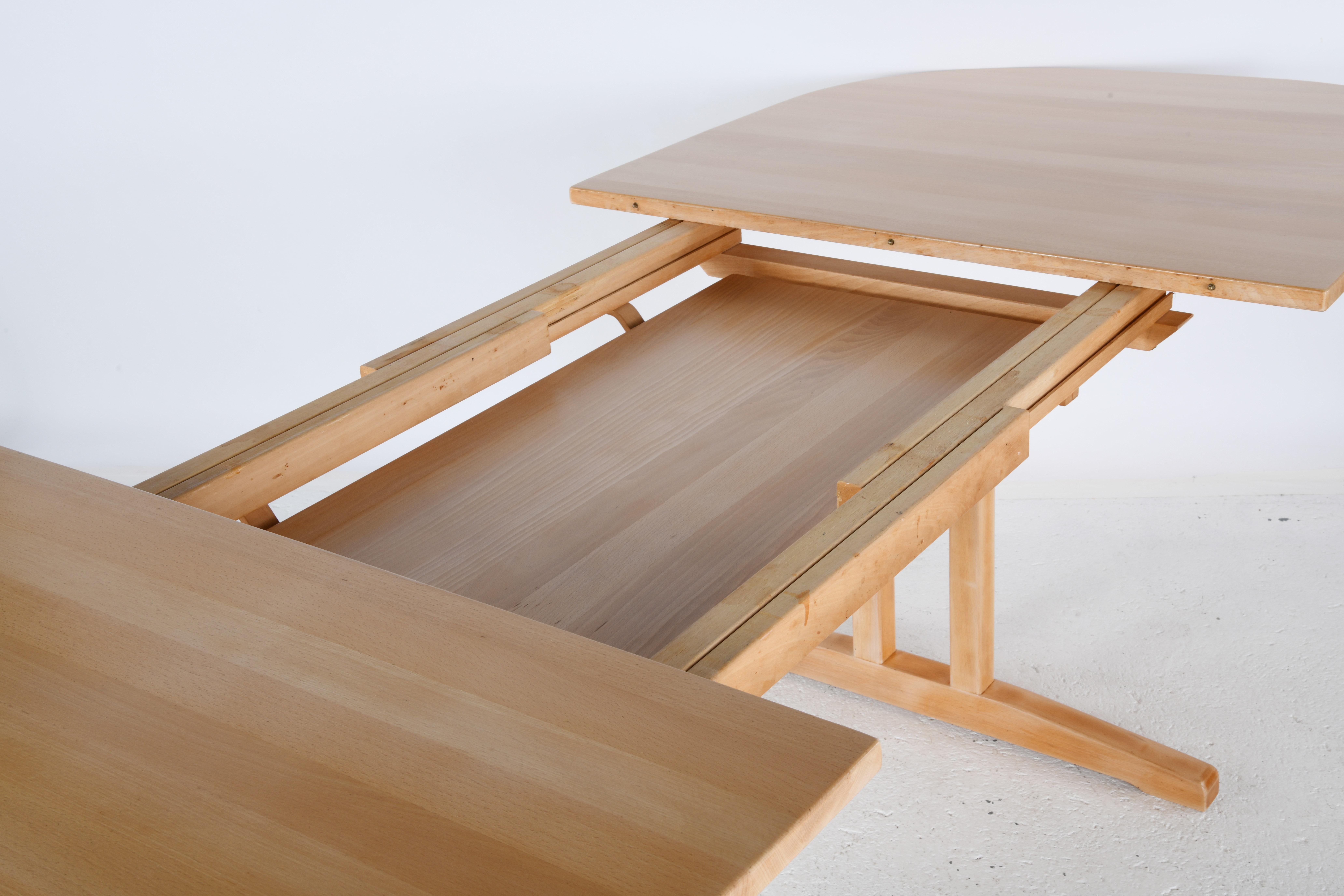 Beech Large solid beech oval table with sliding top and two extensions. For Sale