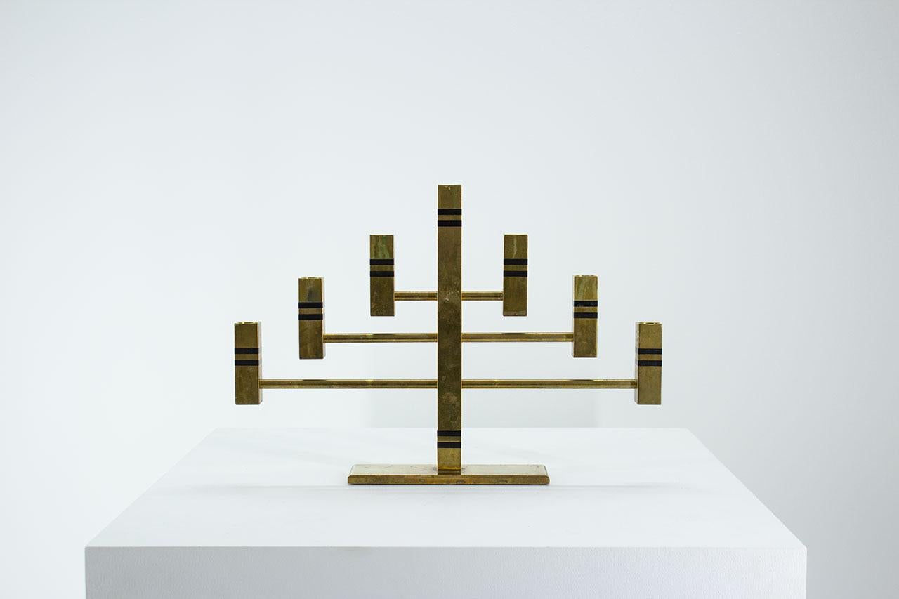 Beautiful large and heavy solid brass candelabra. Manufactured by Vällonmässing in Sweden in 1988. Made from solid brass with black
striped inlays. Fits standard size candles. Signed, engraved on the bottom.