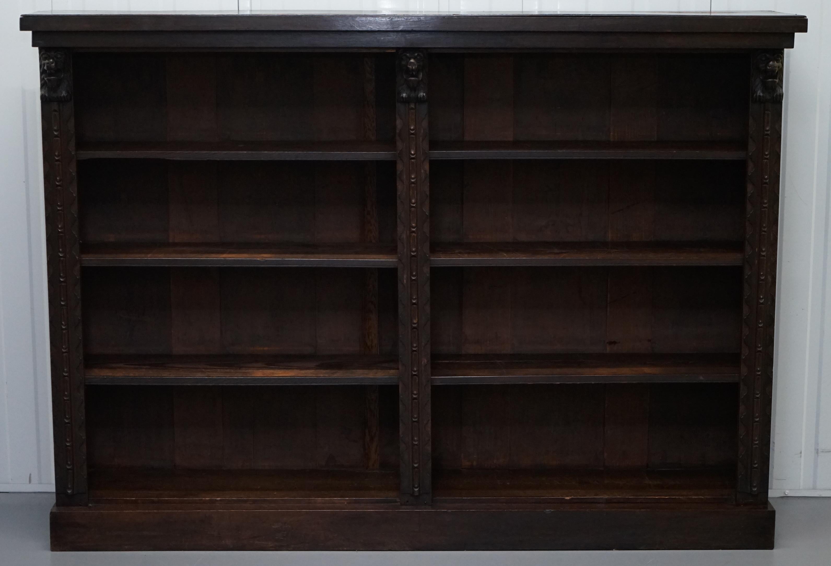 We are delighted to offer for sale this stunning large solid English oak carved bookcase with Lions heads

A good looking well made and decorative piece, there are three Lions heads, the shelves are removable, this is a good solid decorative piece