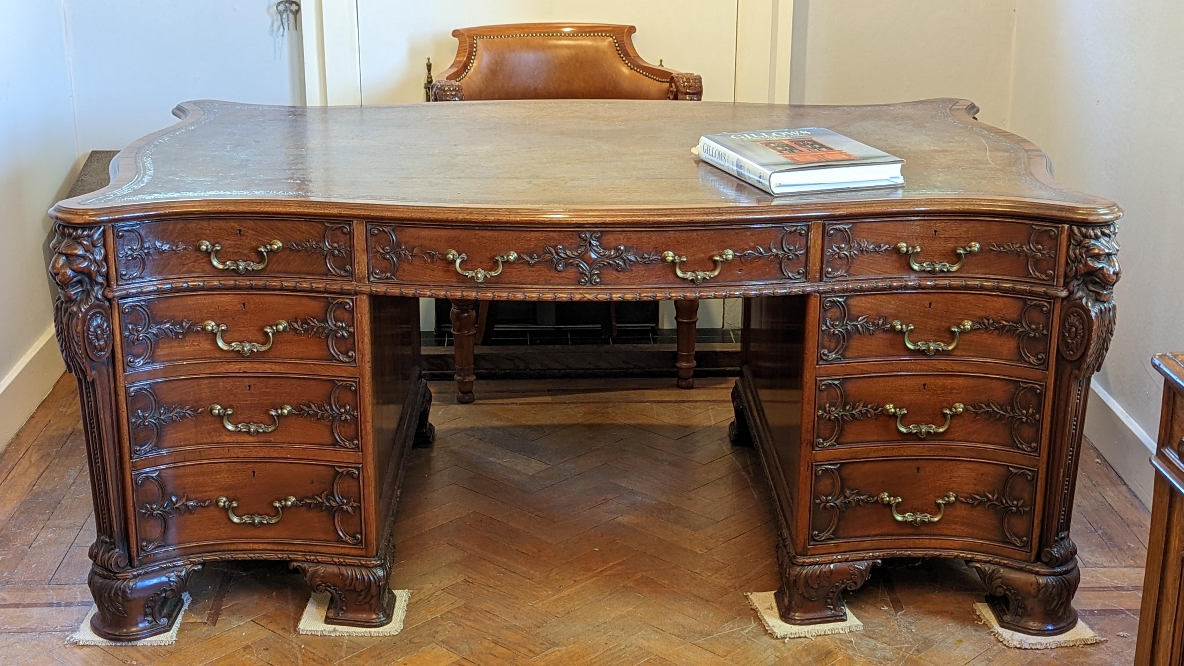 This superb shaped pedestal partners desk was made in the Victorian period of about 1870. It was made in the famous Gillows Cumbrian Workshop and the drawers and some of the locks are stamped Gillows or Gillows Lancaster. The solid serpentine shaped