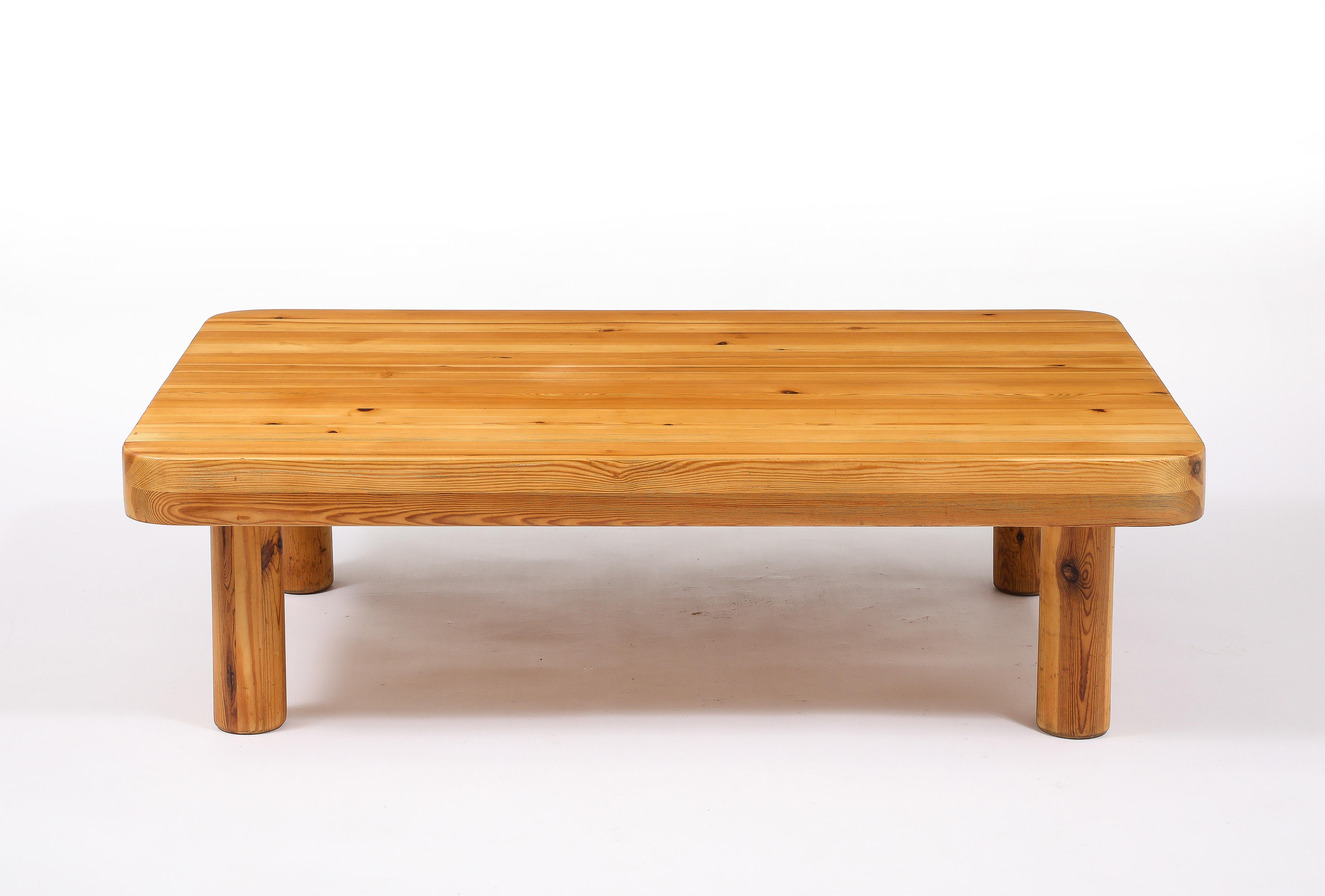 Large Rectangular Pine coffee table in the manner of Perriand on four removable round legs