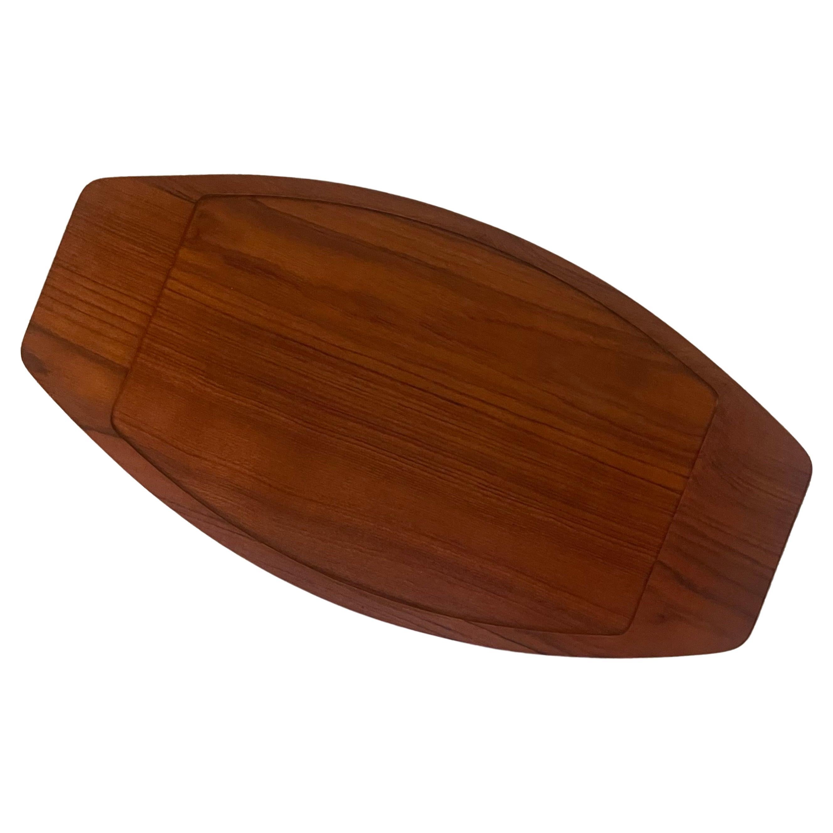 Beautiful large solid teak surfboard tray with raised edge by Digsmed, circa 1950s.  The piece is in good vintage condition and measures 22.5
