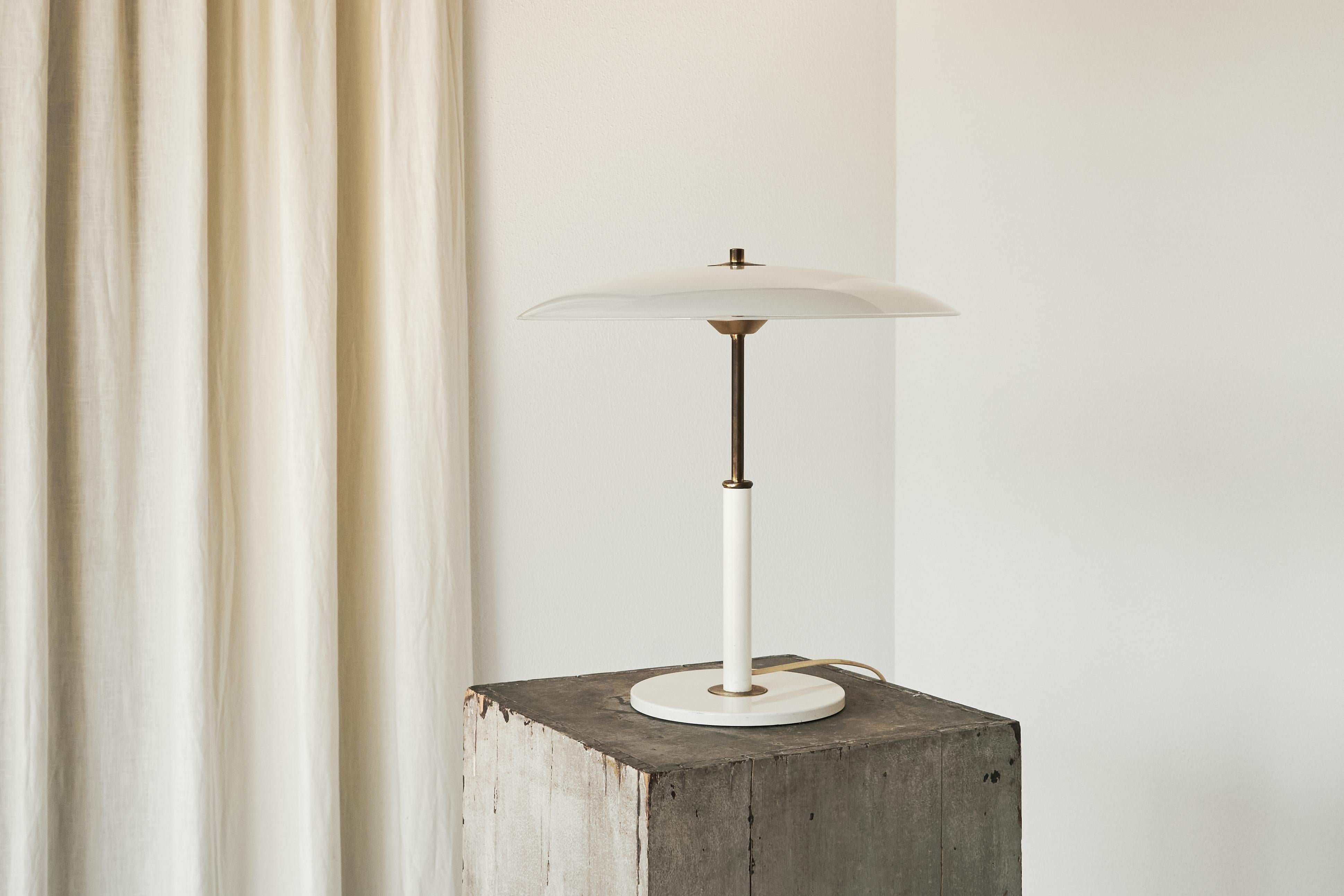 Large 'Solist' Table Lamp in Metal, Brass and Opaline Glass for IKEA, Sweden, 1990.

This is a remarkable modernist table lamp in metal, patinated brass and opaline glass. Wonderful size and presence. Also a high level of quality and execution. One