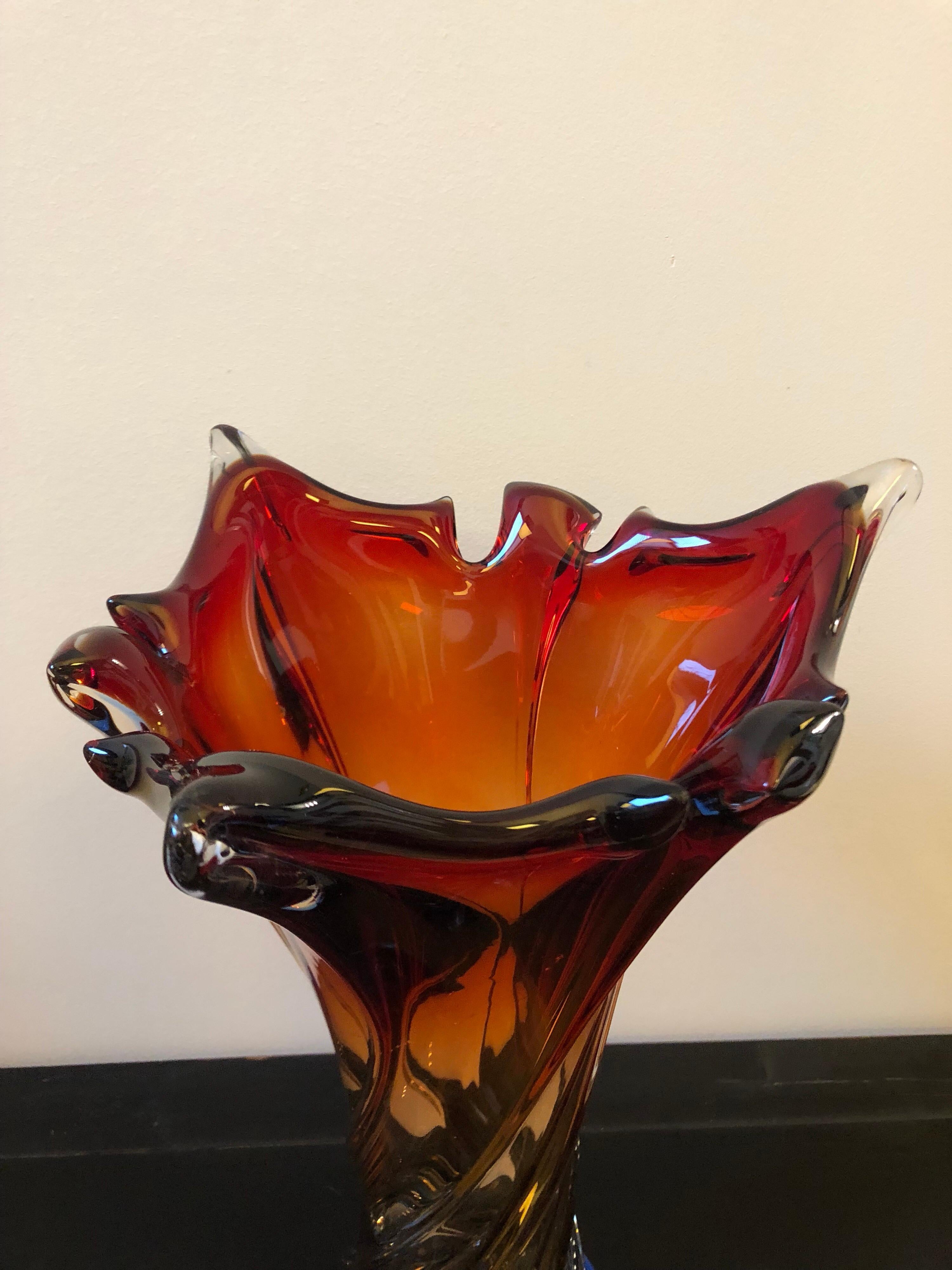 An handcrafted orange, red and blue Murano glass vase in perfect conditions. It has been realized with the Sommerso glass technique in the style of Seguso.