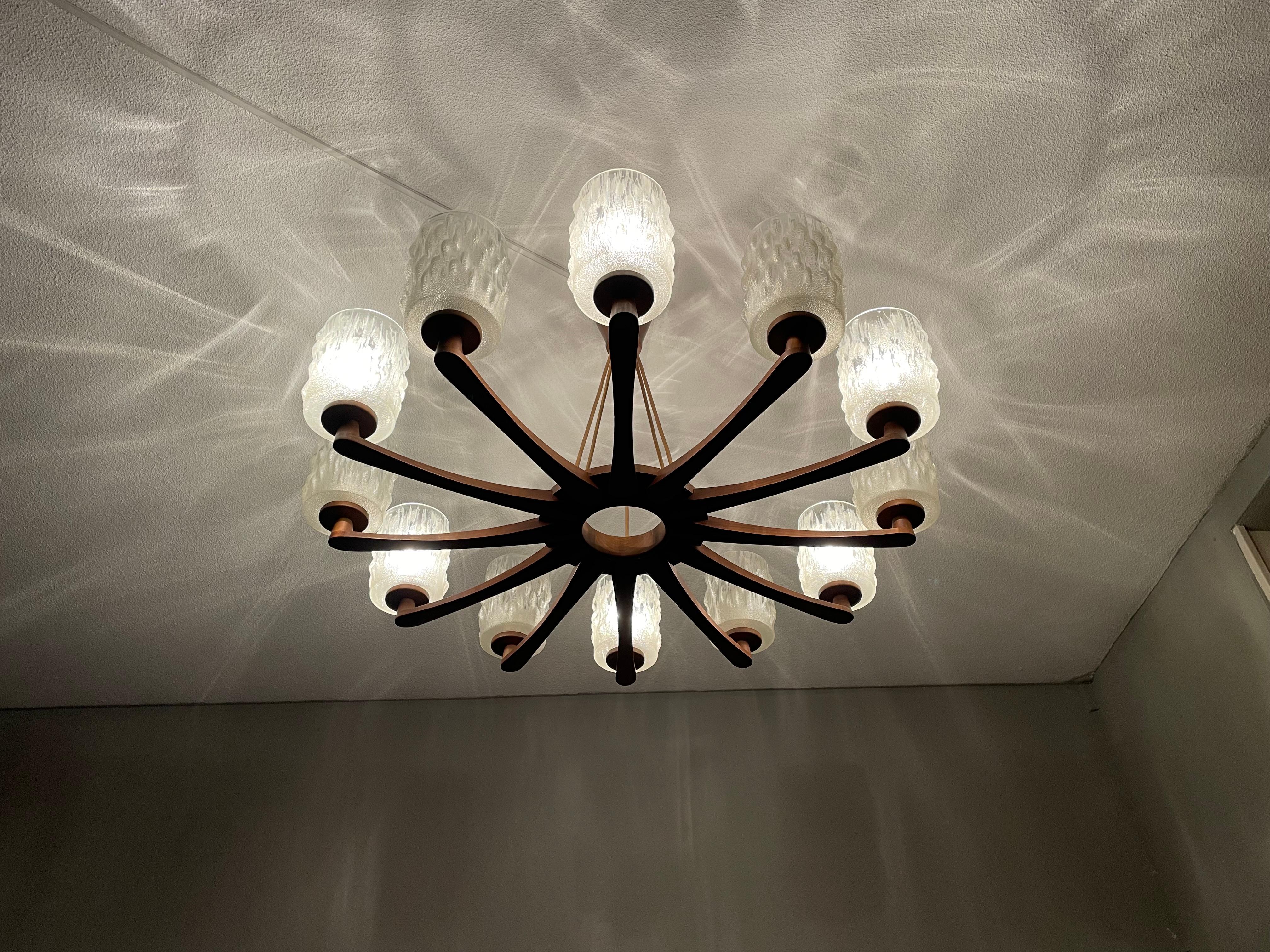 Awesome and large size pendant light from the heydays of the European Mid Century design era. 

If you are looking for a large and truly stylish chandelier to complement your midcentury or your contemporary interior then this handcrafted,