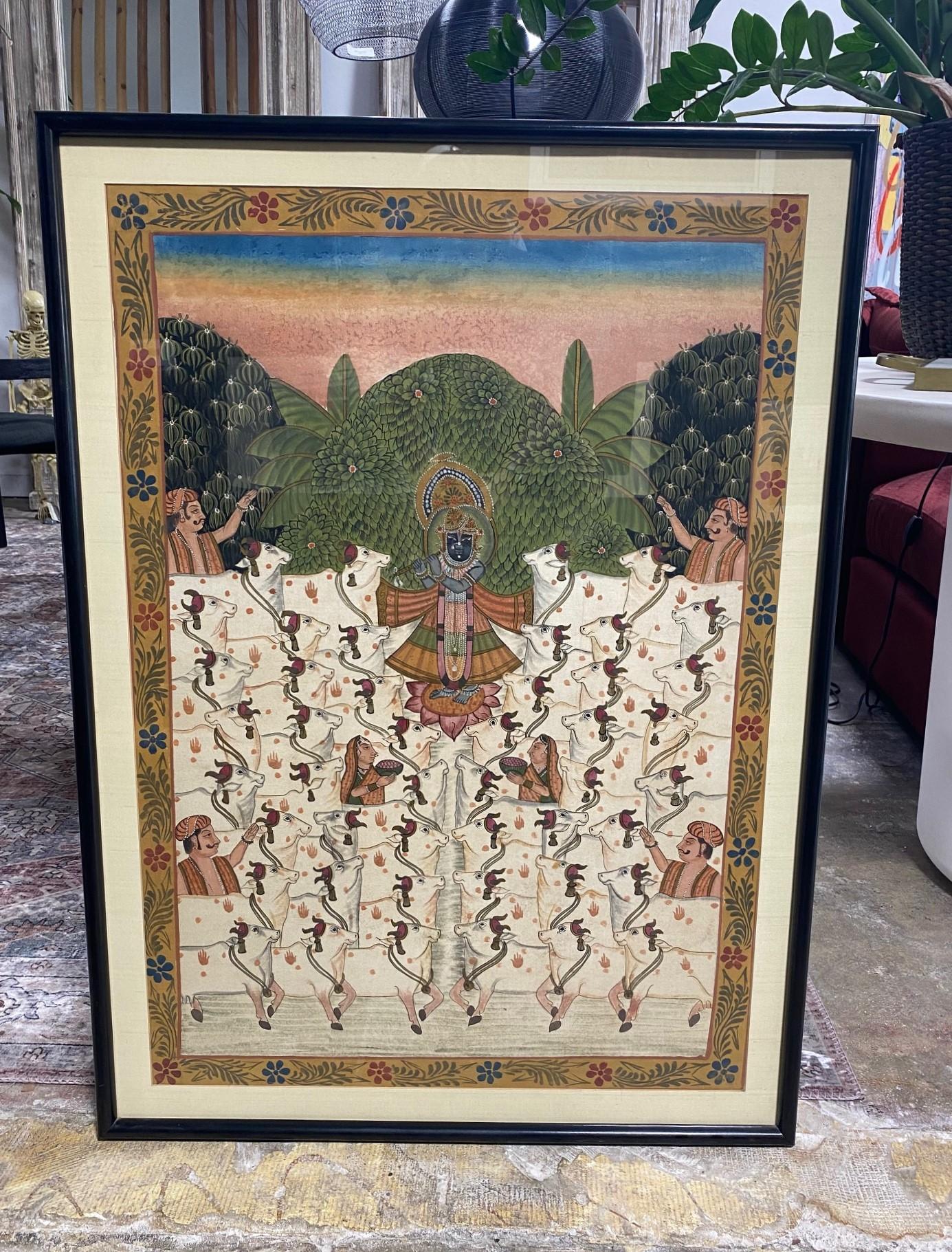 A truly gorgeous and engaging South Indian Asian (India) Pichwai Painting featuring Lord Krishna (sometimes incarnated as Lord Shreenath) - the Hindu God of protection, compassion, tenderness, and love - playing his flute (or bansuri) and calling