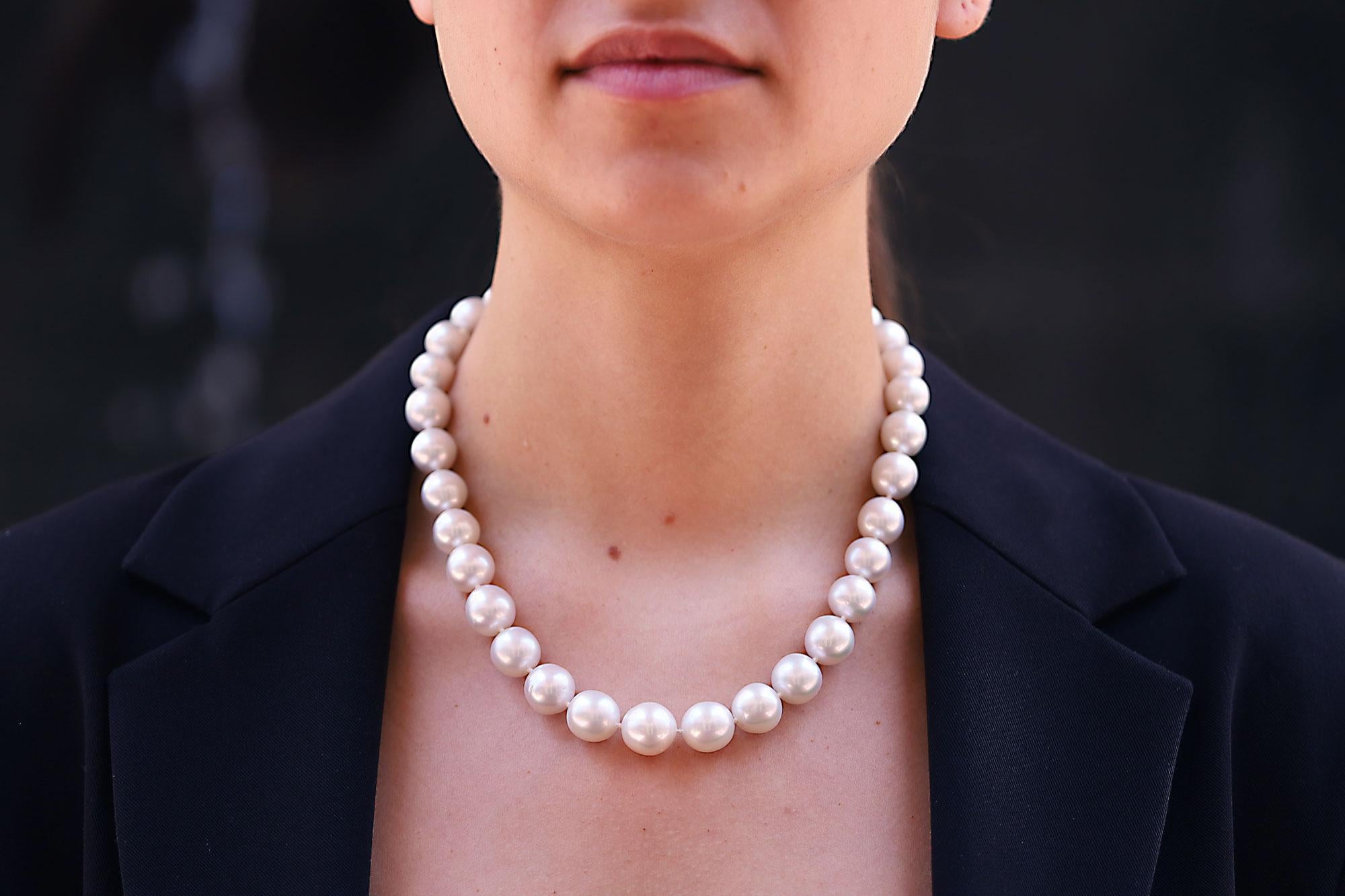 A Sumptuous strand of cultured South Sea pearls drape magnificently down this graduated necklace. Kissed by mother nature with an icy white sheen and luster. Given their impressive size, graduating from 11mm to 13mm, this elegant necklace lays