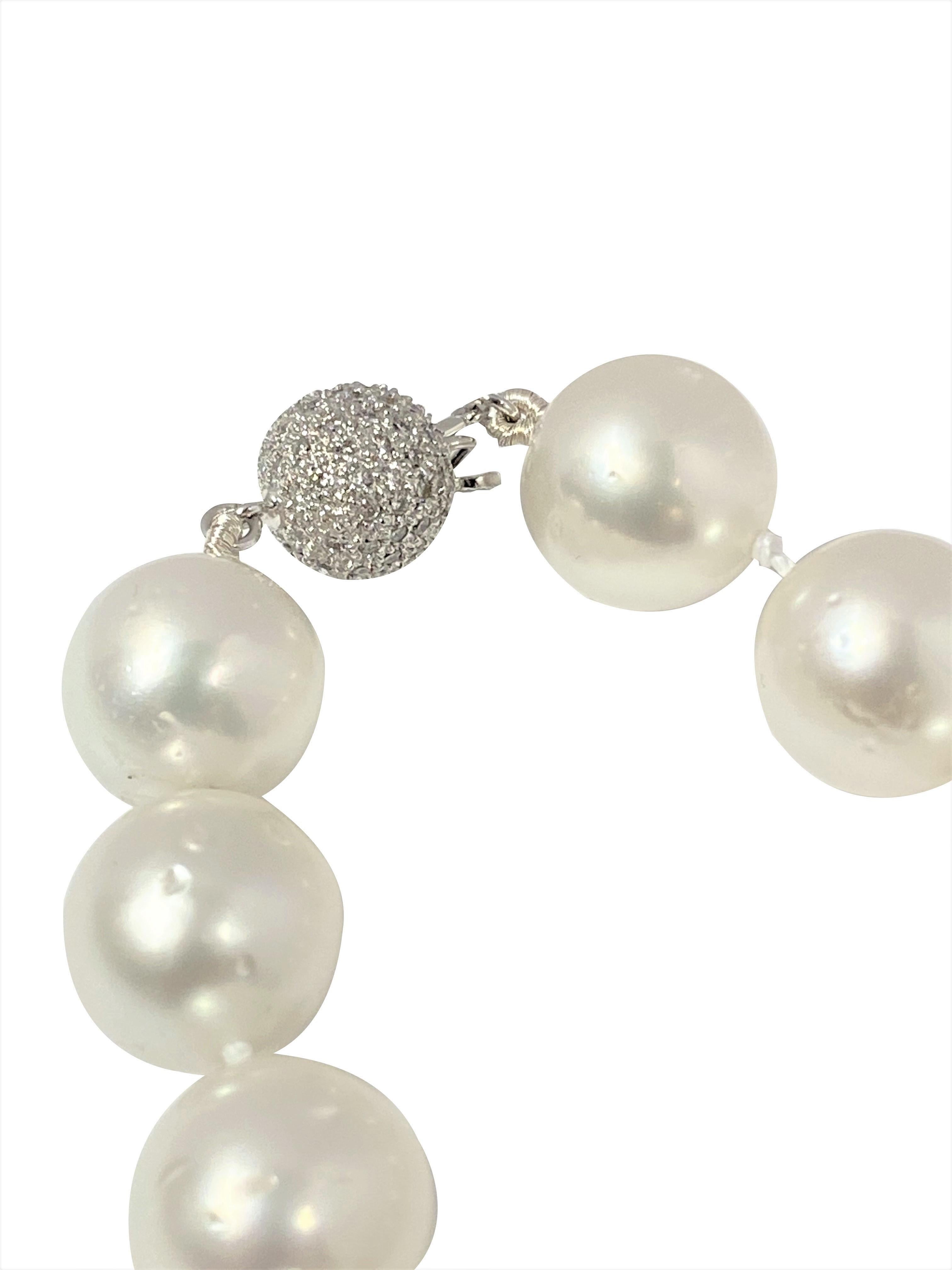 A large and impressive South Sea Pearl necklace Comprised of mostly Round cultured Pearls showing some minor surface blemishes and all having a fine White luster with a hint of Pink. The Pearls range in size from 15.5 M.M. to 13 M.M. with the