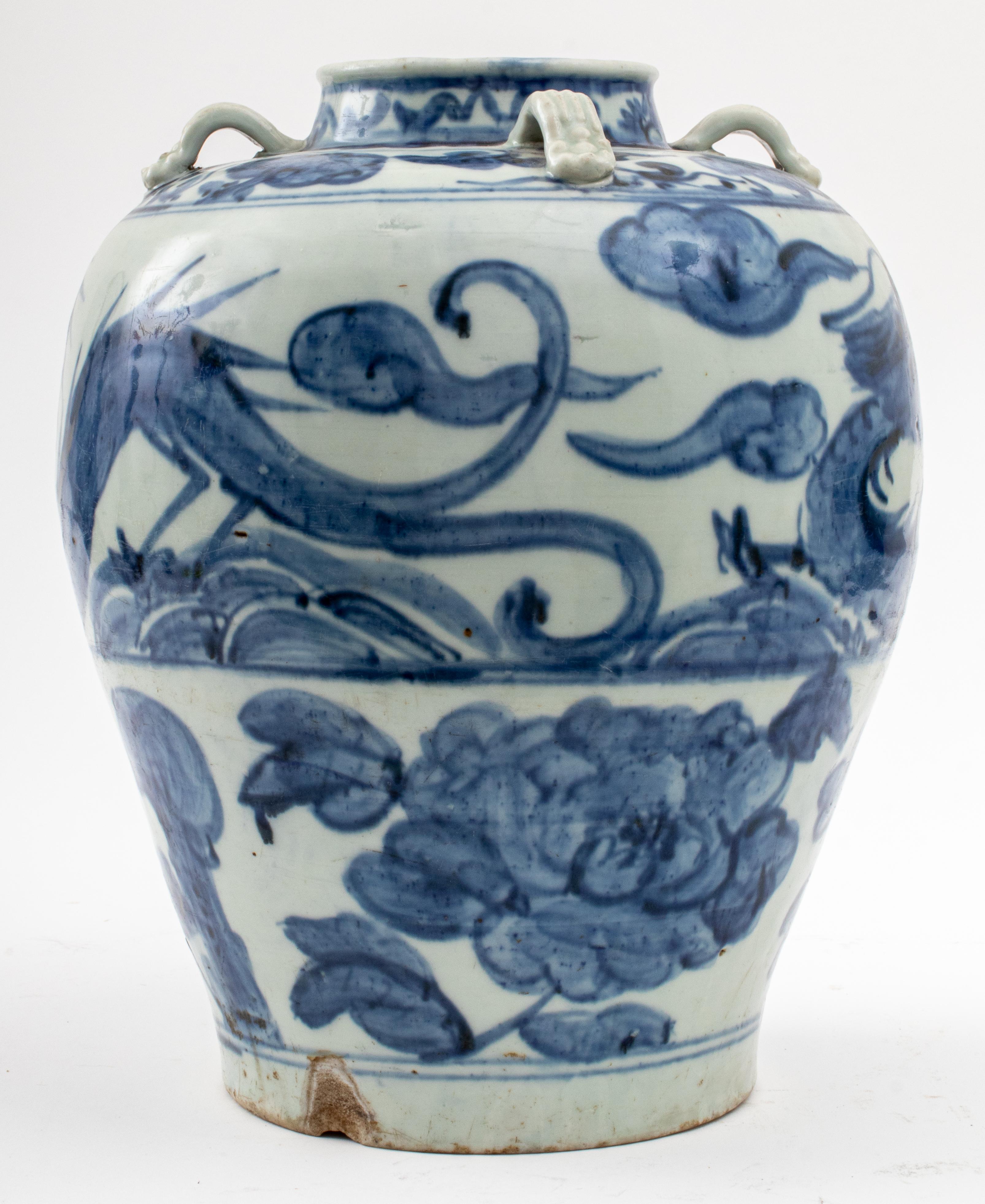 Large antique Southeast Asian ceramic pottery Meiping plum vase with blue hand-painted dragon, cloud, and chrysanthemum decoration on a pale celadon glazed ground, with four stylized handles at the shoulder, no visible marks. 14