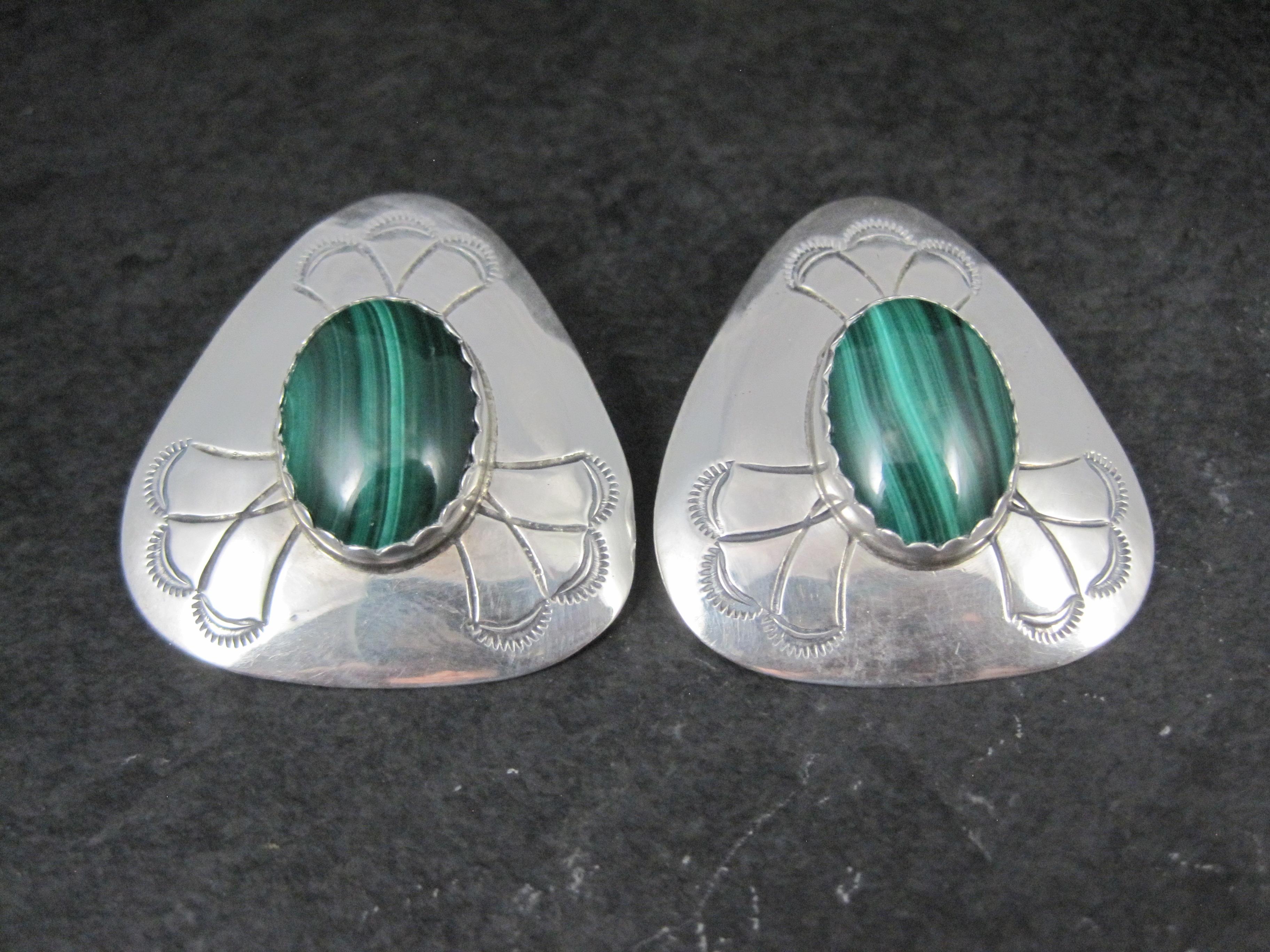 These gorgeous Southwestern earrings are sterling silver.
They feature stunning genuine malachite stones.

These earrings measure 1 6/16 by 1 7/16 inches.

They are unmarked.
They do test as sterling silver

Condition: Excellent

All of the vintage