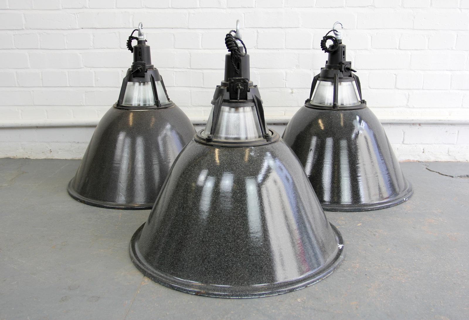 Large Soviet Industrial factory lights, circa 1950s

- Vitreous black enamel outers with white enamel inner reflectors
- Prismatic glass diffuser at the top of the lamps
- Fully re wired with new bulb holders and cable
- Comes with 100cm of
