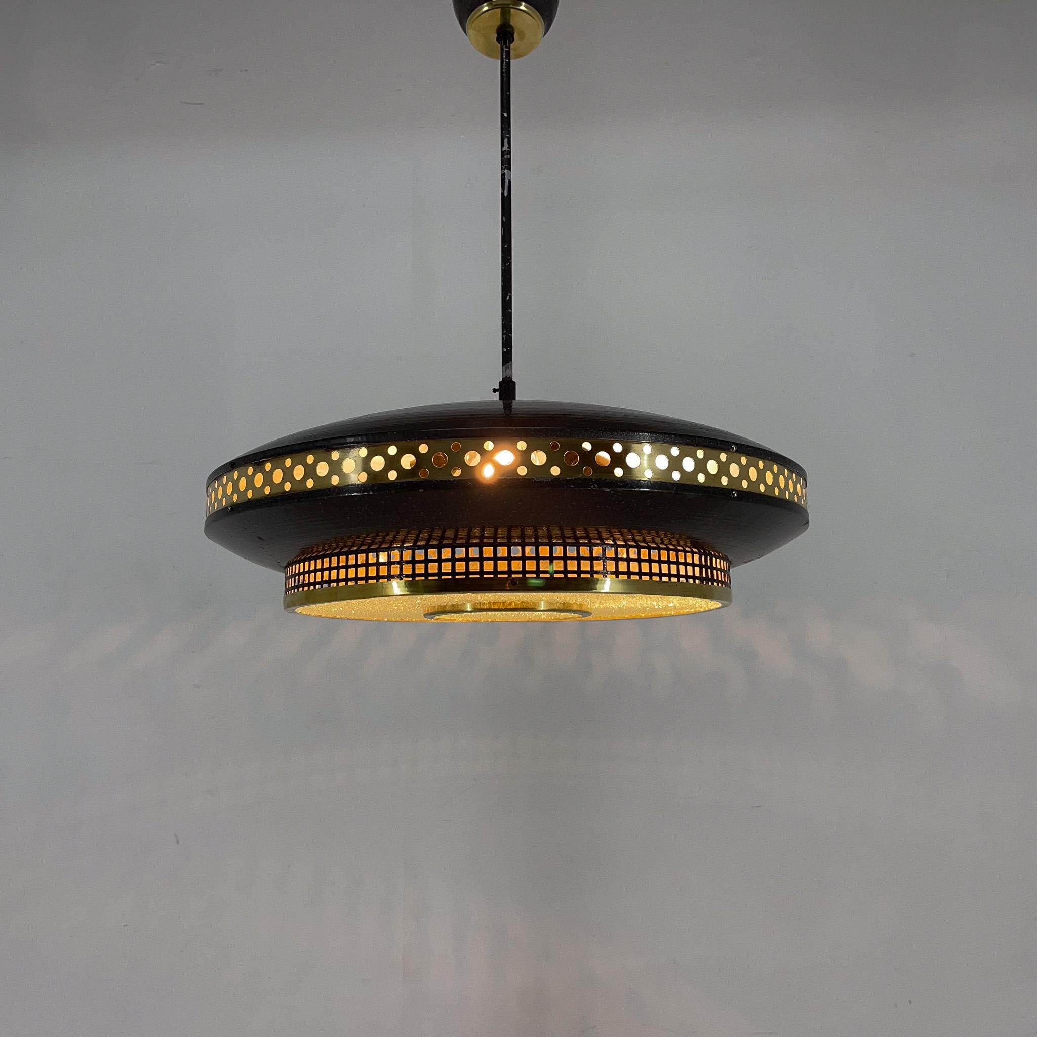 Dark grey metal ring pendant with brass perforated strip by ĽUDIB Bratislava. Manufactured in former Czechoslovakia in the 1960's.
Bulbs: 3 x E26-E27. 
US wiring compatible.