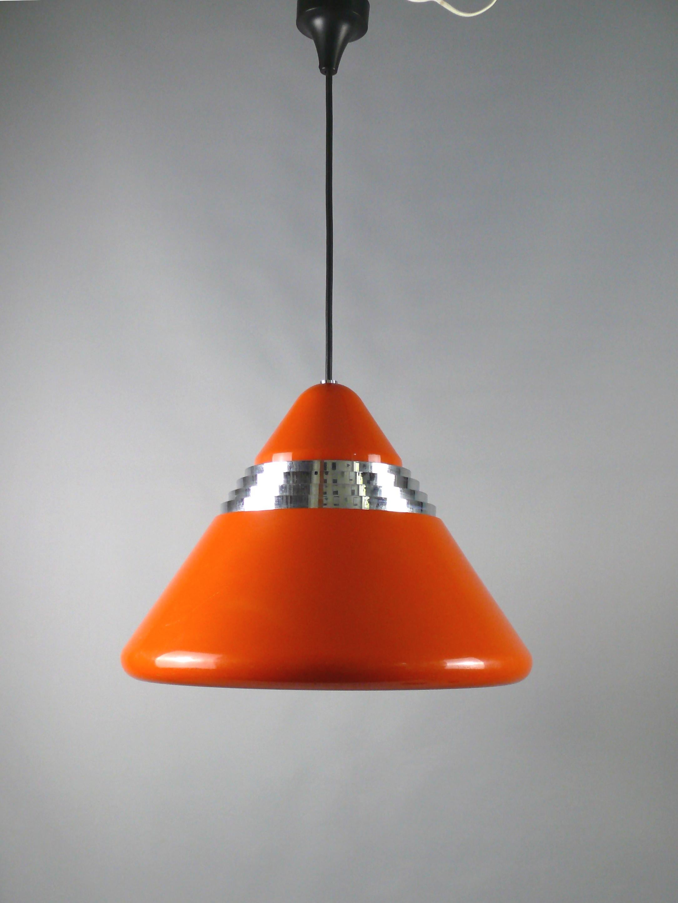 Pendant lamp with red painted screen, Staff Germany model 5535/36 - design Alfred Kalthoff, probably manufactured in 1967.

Rare design classic from the 1960s in a design typical of the time with a conical shade, rounded edges and chrome ventilation