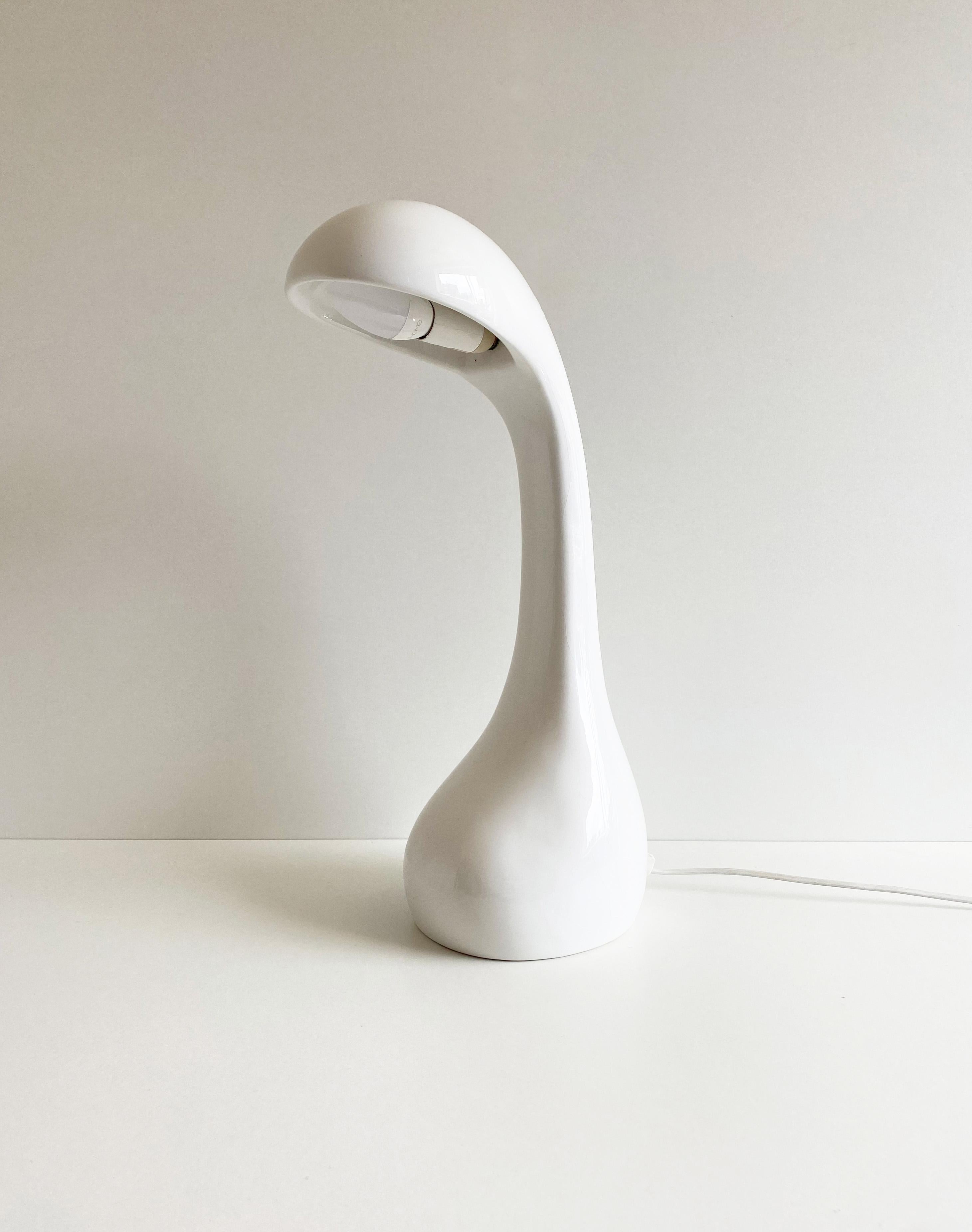 Tall white glazed earthenware desk lamp from the 1960's.

Dimensions (cm, approx): 
Height: 49 
Width: 18 
Depth: 30

Condition: Good condition for year with no cracks or chips but minor imperfections to the glaze. Please enquire for further