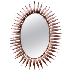 Grand miroir Sunburst espagnol ovale plaqué cuivre des années 1950
