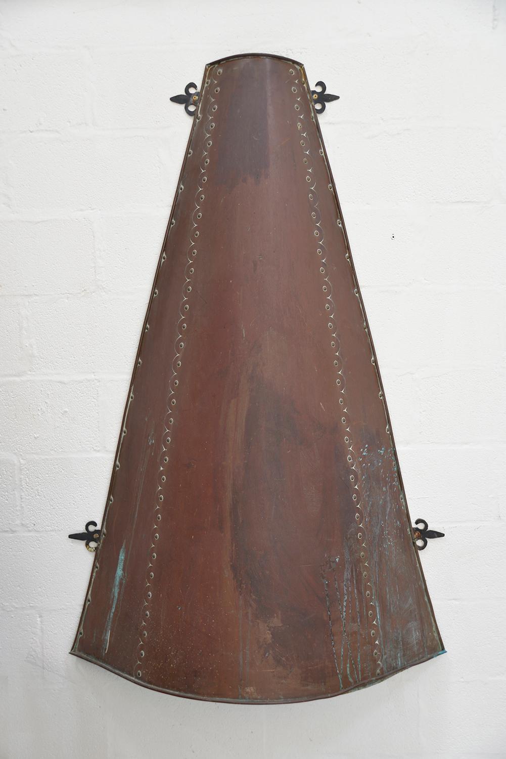 A very large (nearly 5.5ft) conical-shaped copper fireplace hood, removed from a 1960s villa in Ibiza. The unpolished copper fireplace hood has the most wonderful patination and interesting areas of verdigris. 
There are five supports to the back