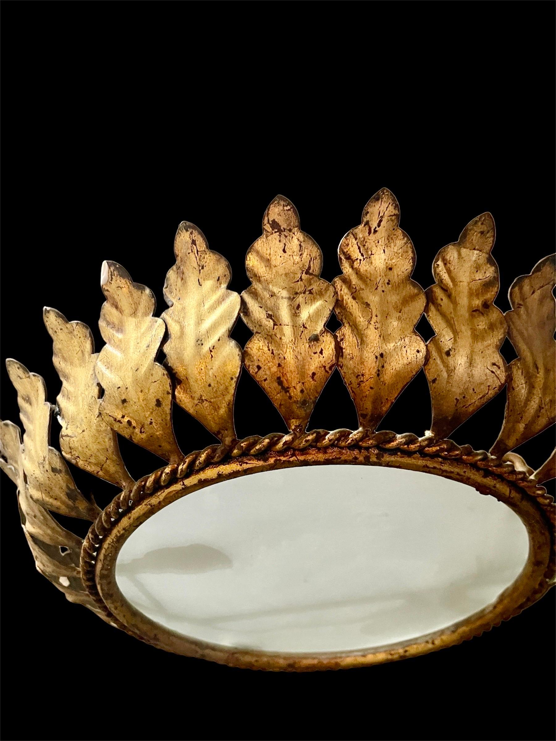 Large Spanish crown light in gilt metal and frosted glass, Spain, 1950s. Midcentury antique gilt iron frame or pendant with laurel leaf motifs surrounding a central frosted glass diffuser. Handcrafted in hammered iron with gold leaf finish. Superb