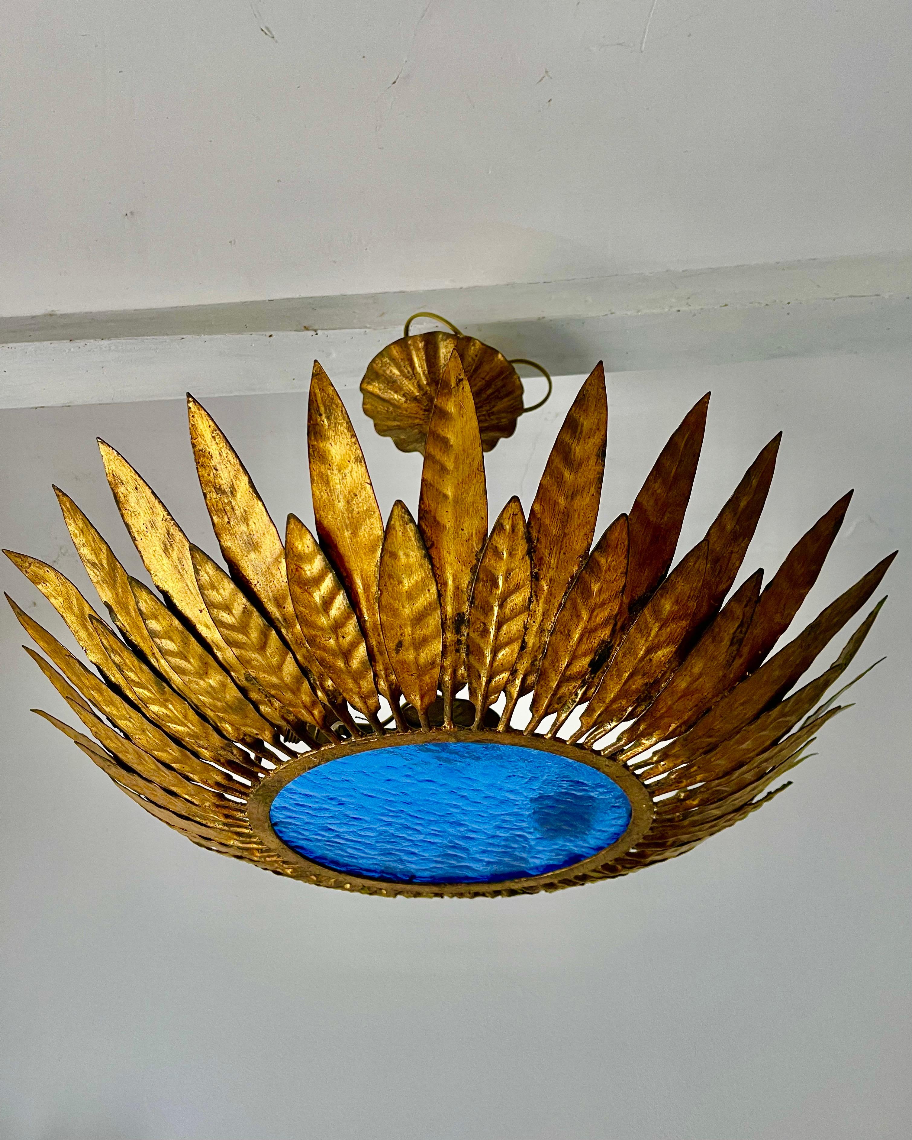 Large Spanish crown light in gilt metal and frosted glass
We have in stock few colors of Glass ! greeen ; white ; orange ; 
, Spain, 1950s. Midcentury antique gilt iron frame or pendant with laurel leaf motifs surrounding a central frosted glass