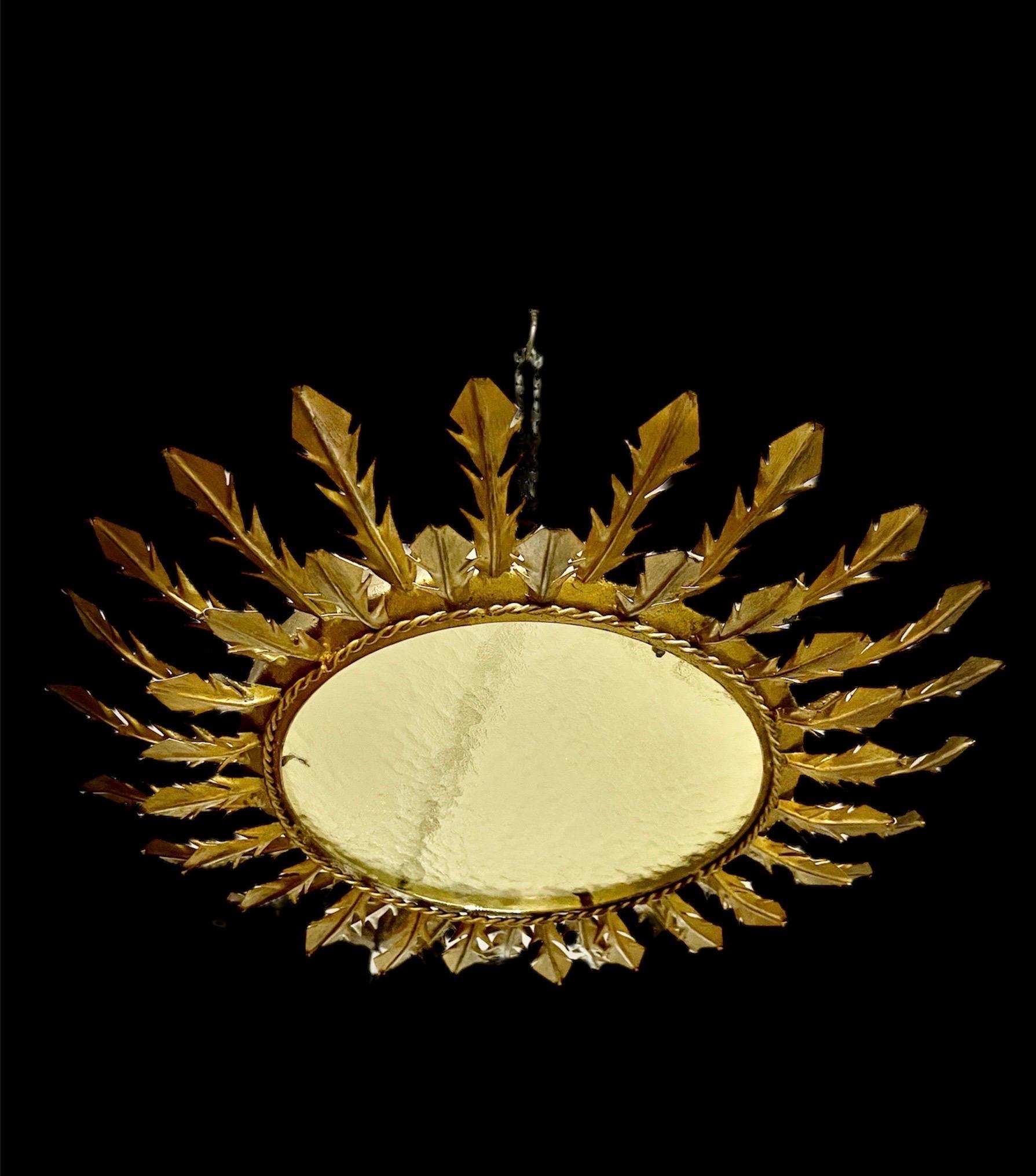 Hammered Spanish solar Crown Sunburst fixture in Gilt Metal and frost Glass , circa 1950