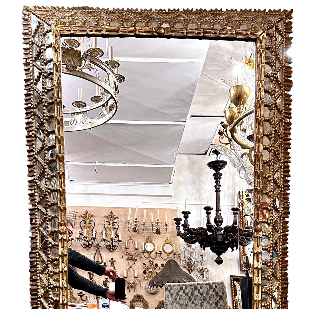 A circa 1900 Spanish gilt wood mirror with mirror insets.

Measurements:
Height: 67