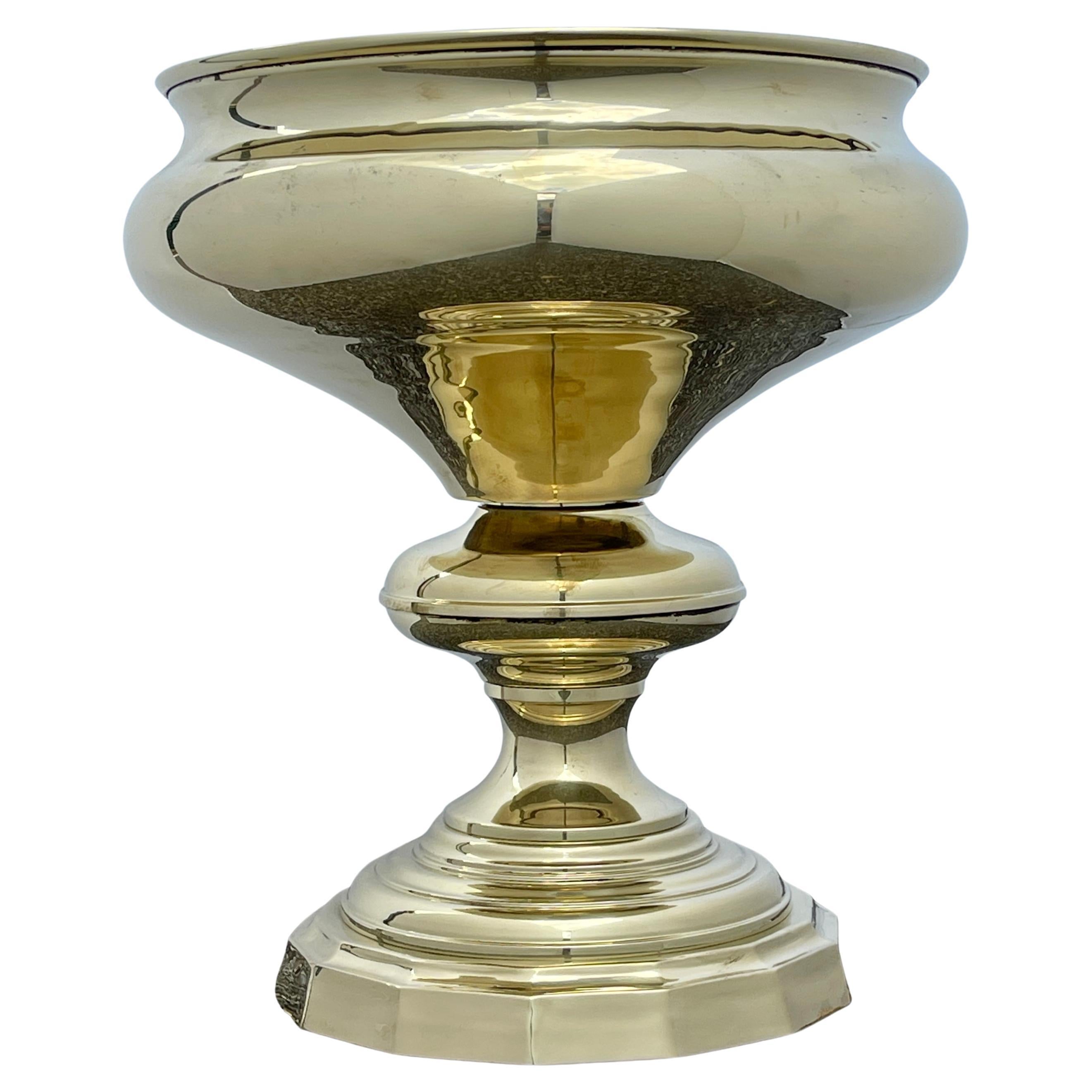 Large Oversized Polished Brass Metal Pot Planter midcentury Spain. 

Complemented with clean lines, this multifunctional jardiniere offers a refined modern look to a corner in need of an upgrade or can be used a centerpiece on a large table. The