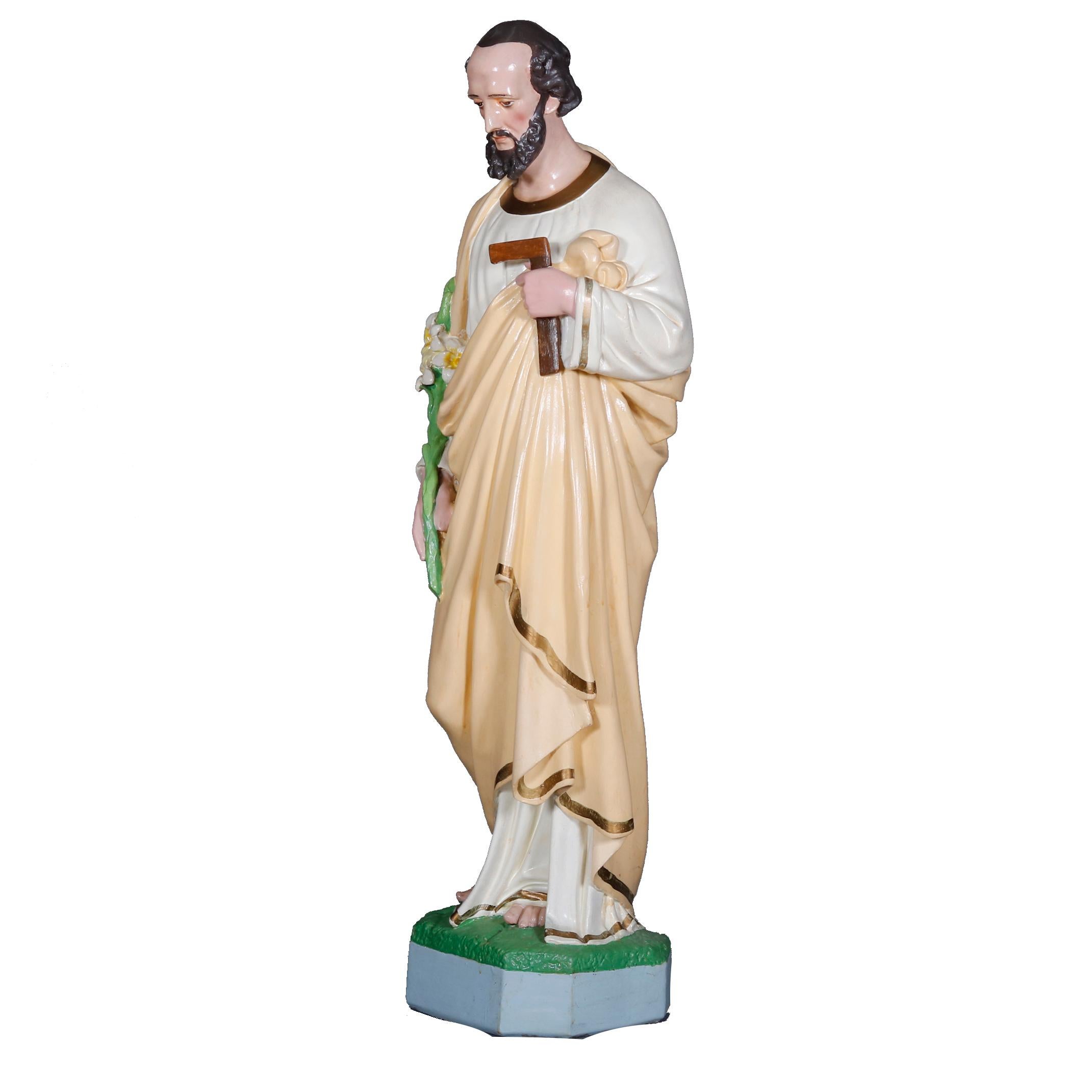 An antique and large full figure Spanish or Italian hollow cast plaster sculptural statue offers hand painted and gilt Christian figure of Saint Joseph with daffodils and carpentry square, Patron Saint of Fathers, circa 1930

Measures: 48.5