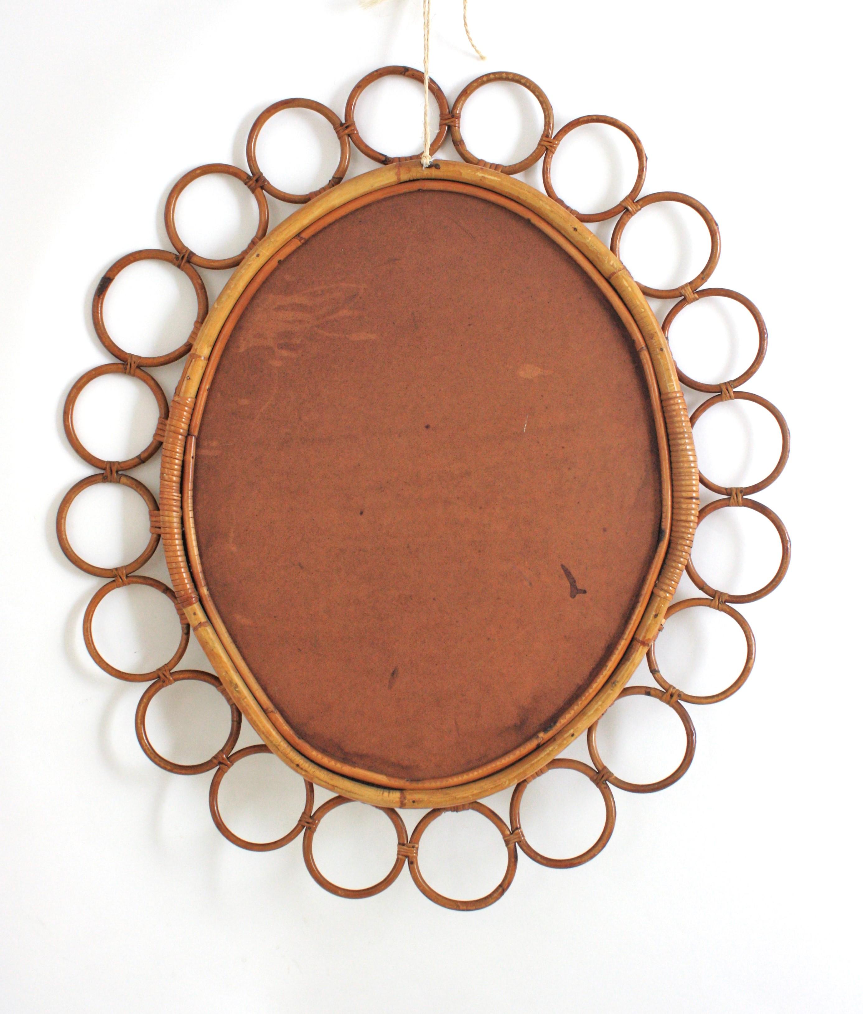 Grande specchio ovale in rattan spagnolo con cornice ad anelli in vendita 4