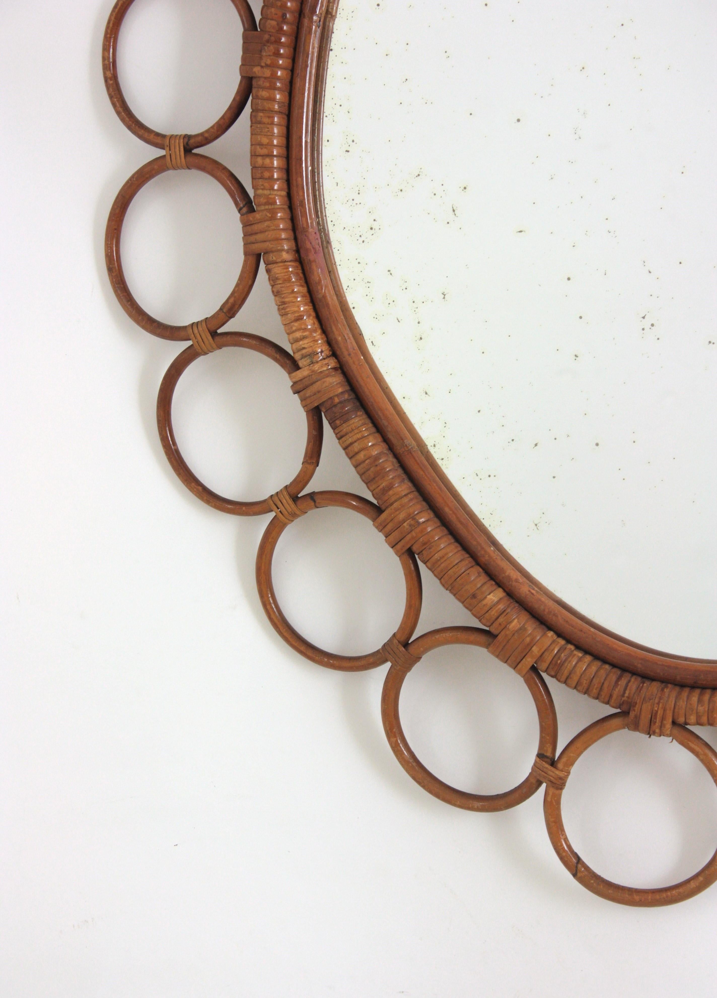 Vimini Grande specchio ovale in rattan spagnolo con cornice ad anelli in vendita