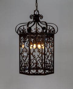 Grande lanterna ottagonale in ferro a volute di epoca spagnola