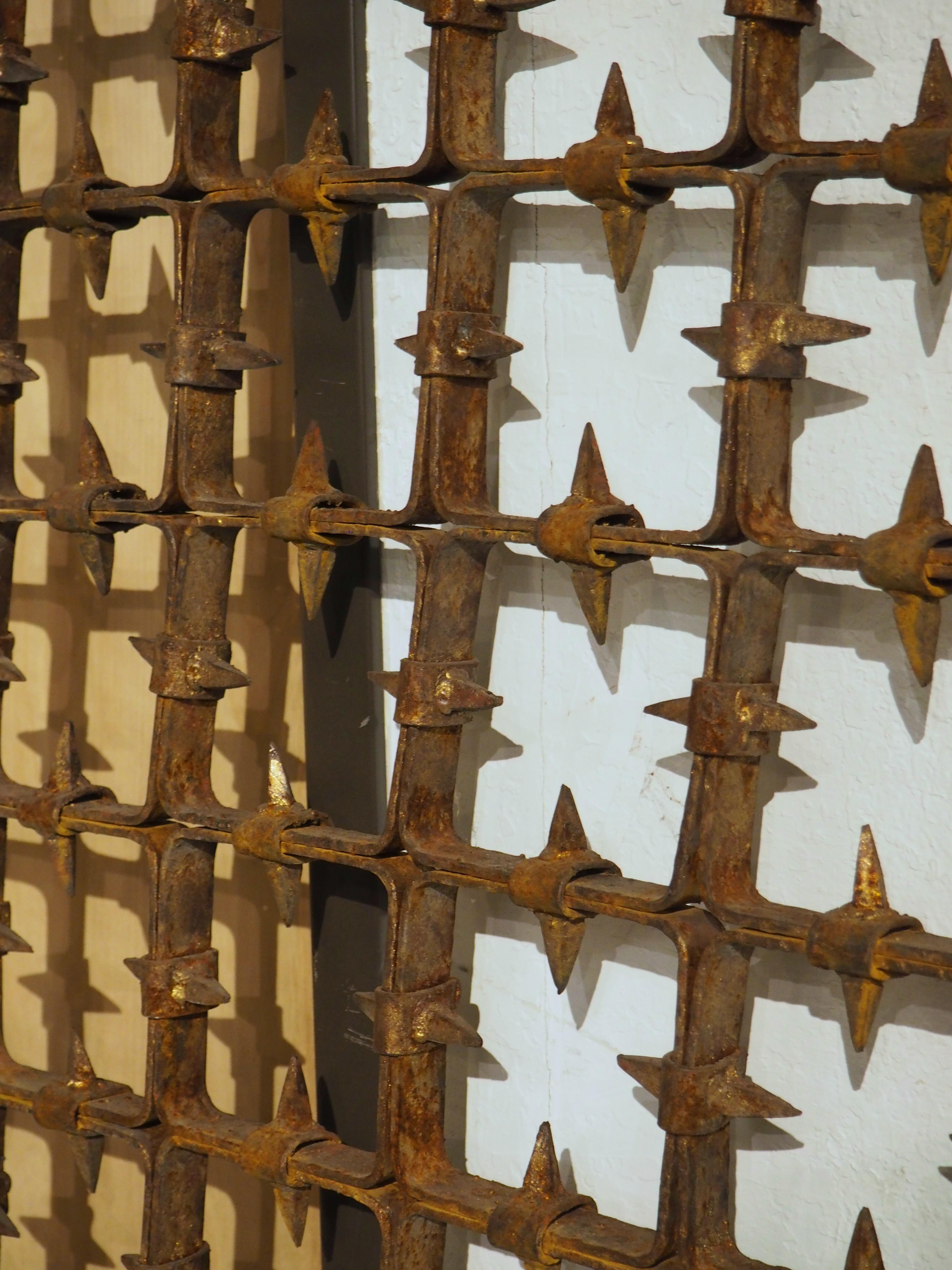 More information coming soon…

A Medieval-style gate in three sections, this fascinating Spanish architectural piece dates to circa 1900.  The gate is in three sections (the main body of the gate, a door, and an L-shaped transom), with a visually